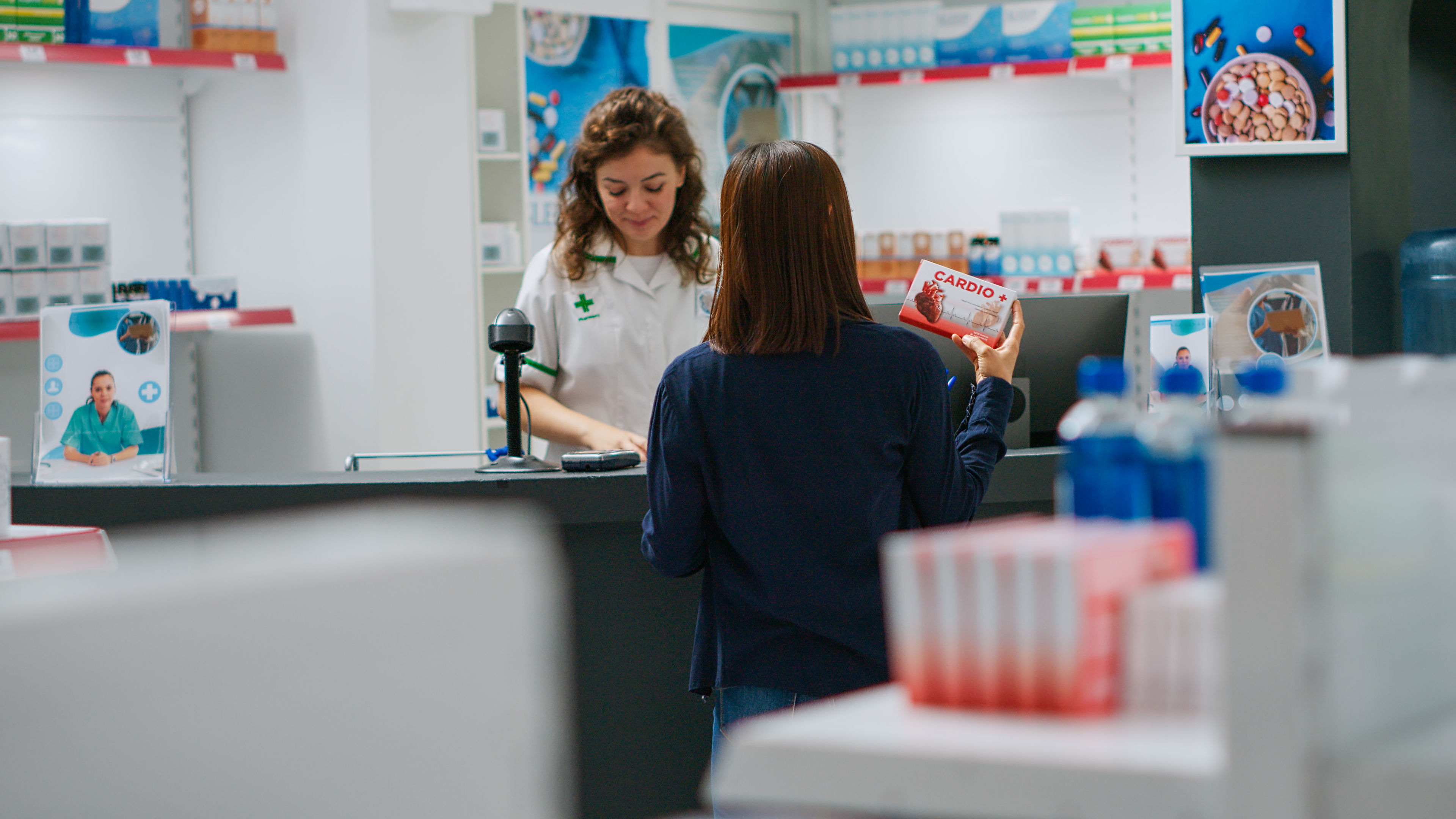 2 Women at pharmacy 