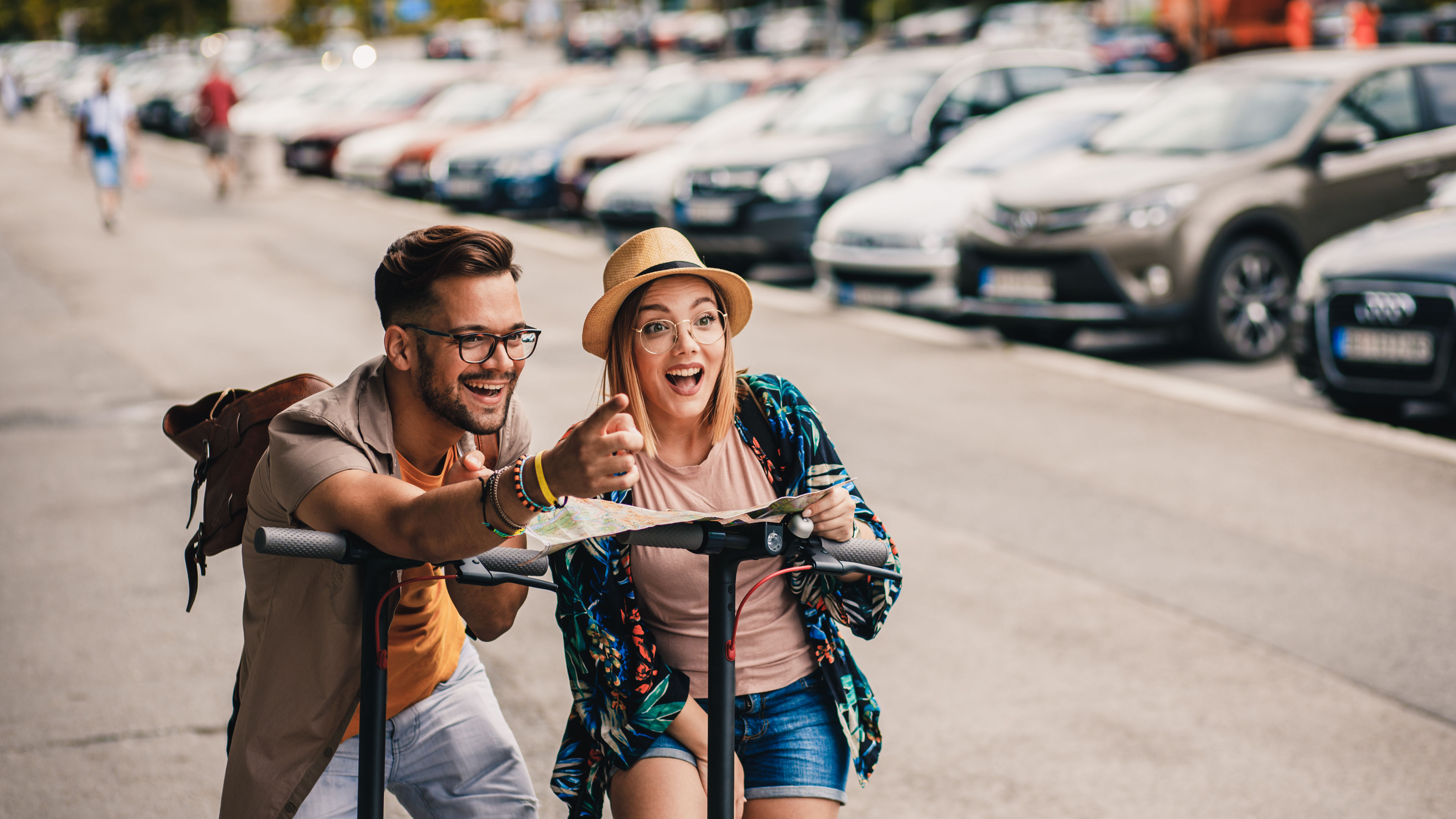A couple on electric scooter 