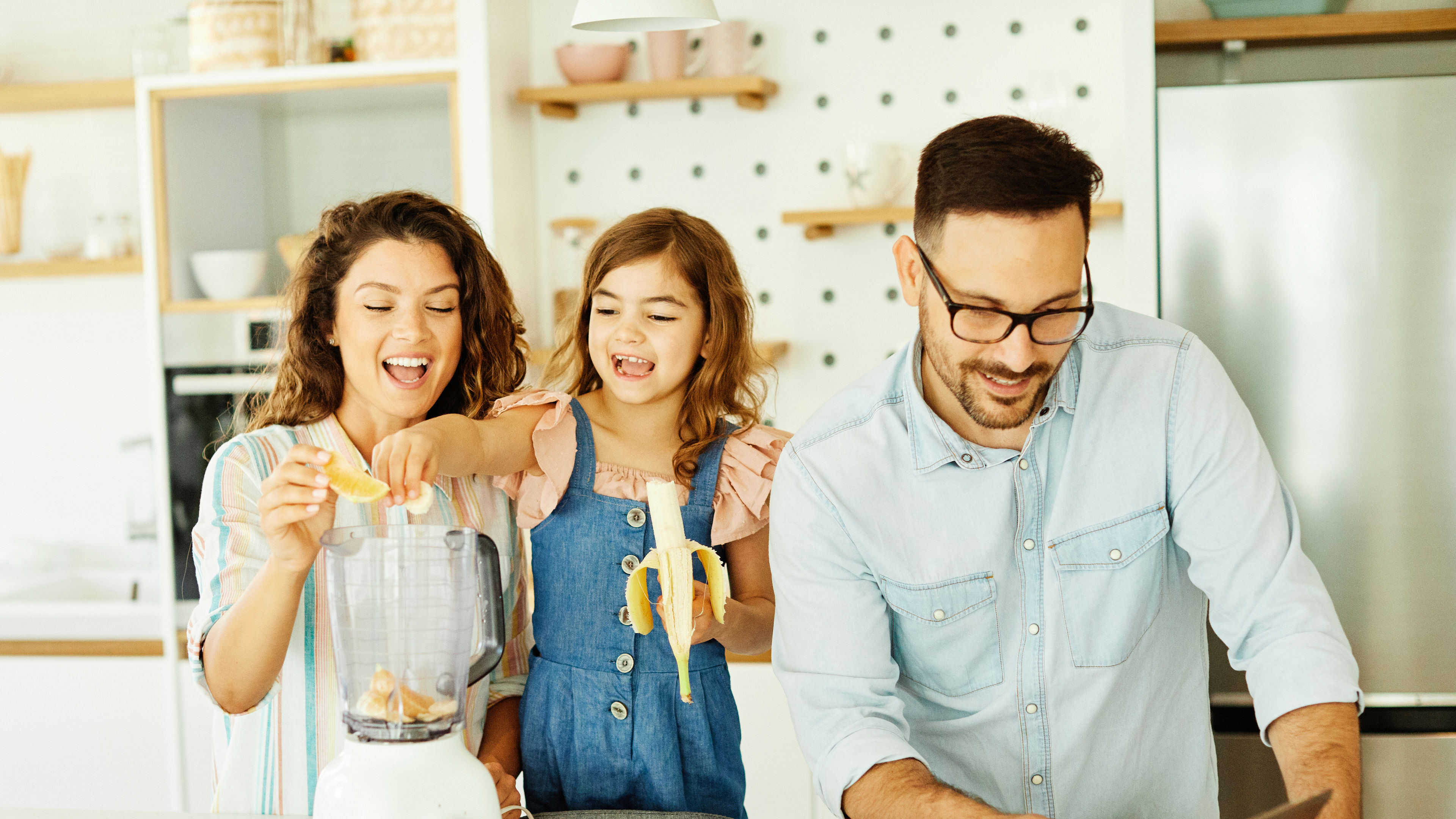 A family of three enjoying cooking together