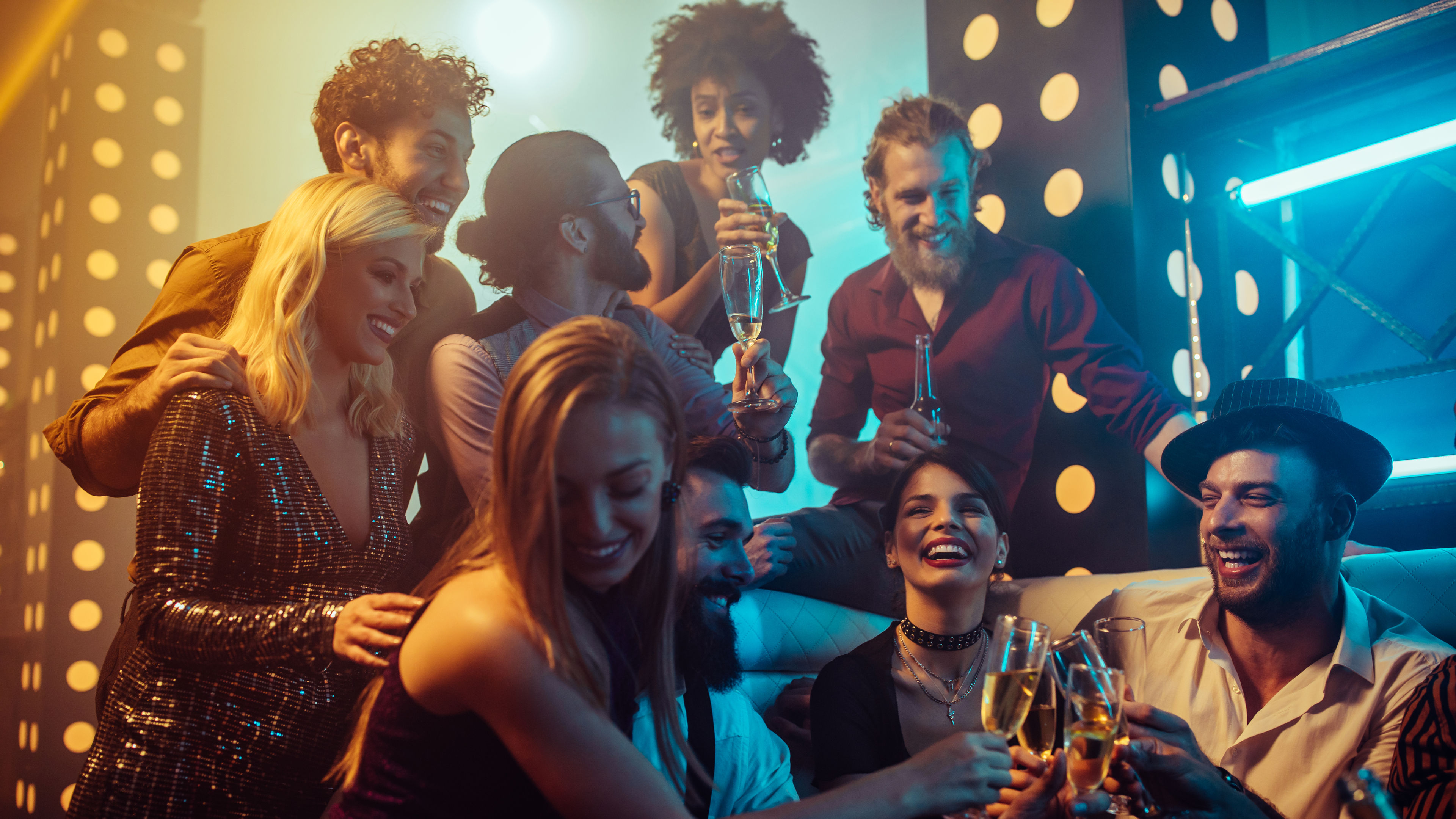 A group of friends celebrates at a lively party