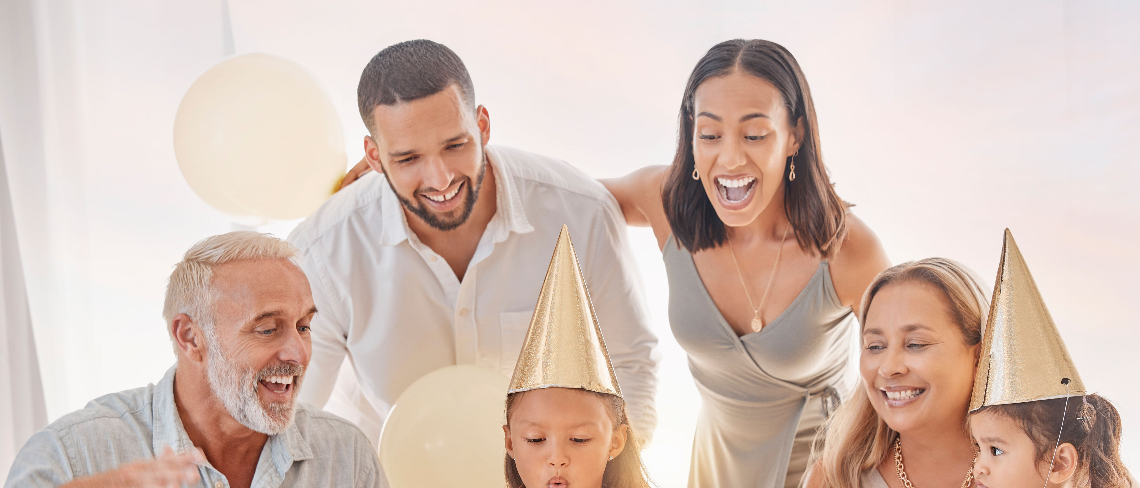 A happy family celebrates a young girl's birthday