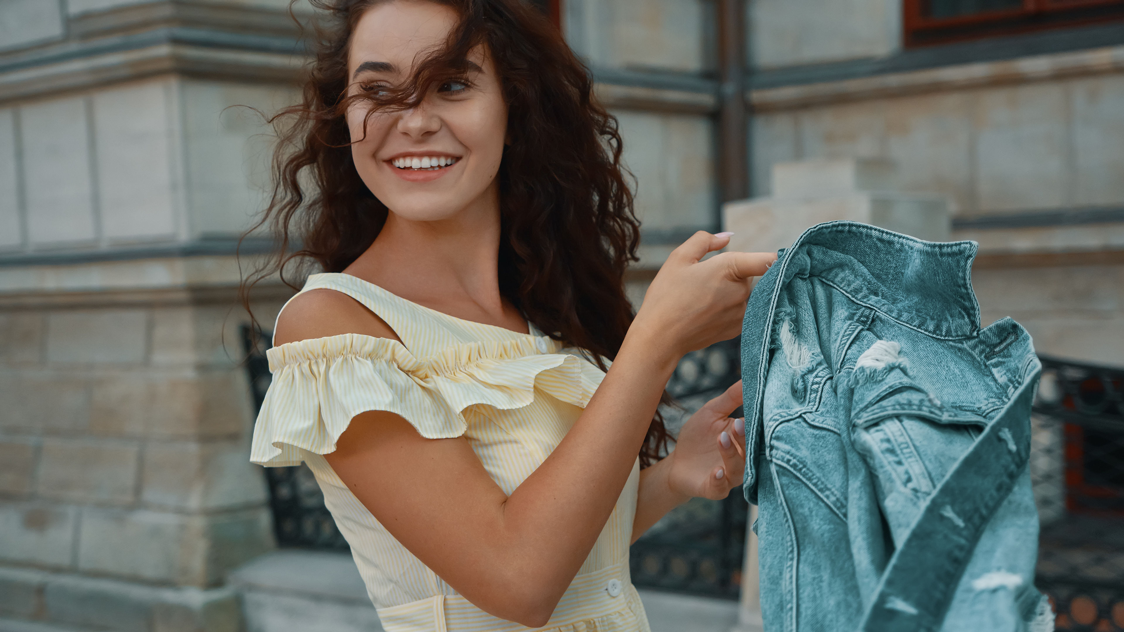 A happy young woman with a jacket