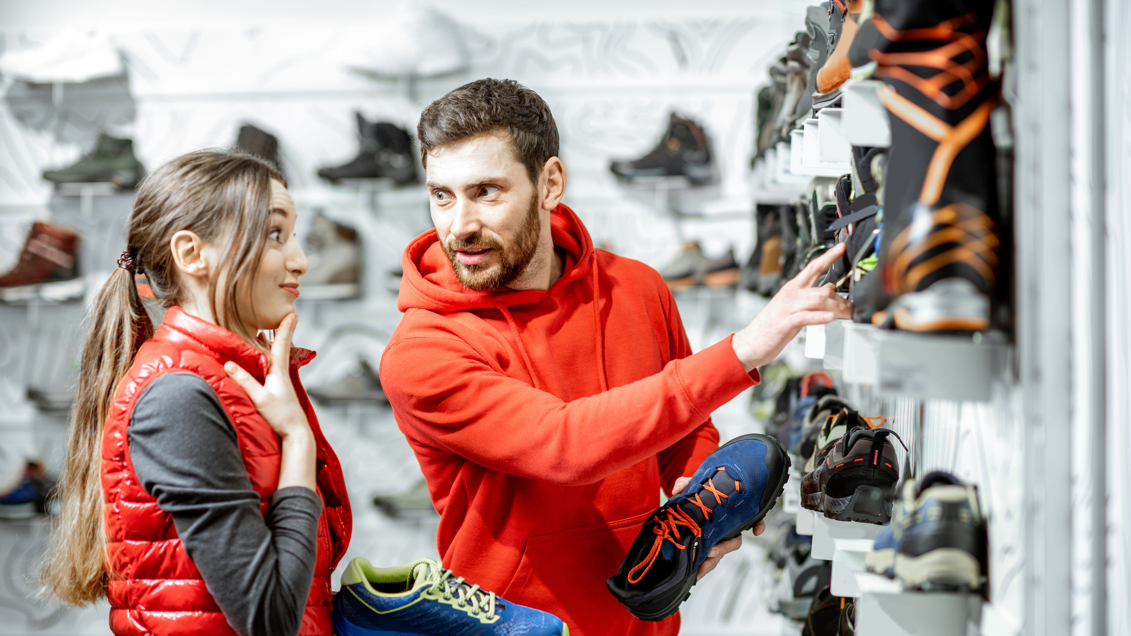 A man and a woman choosing shoes