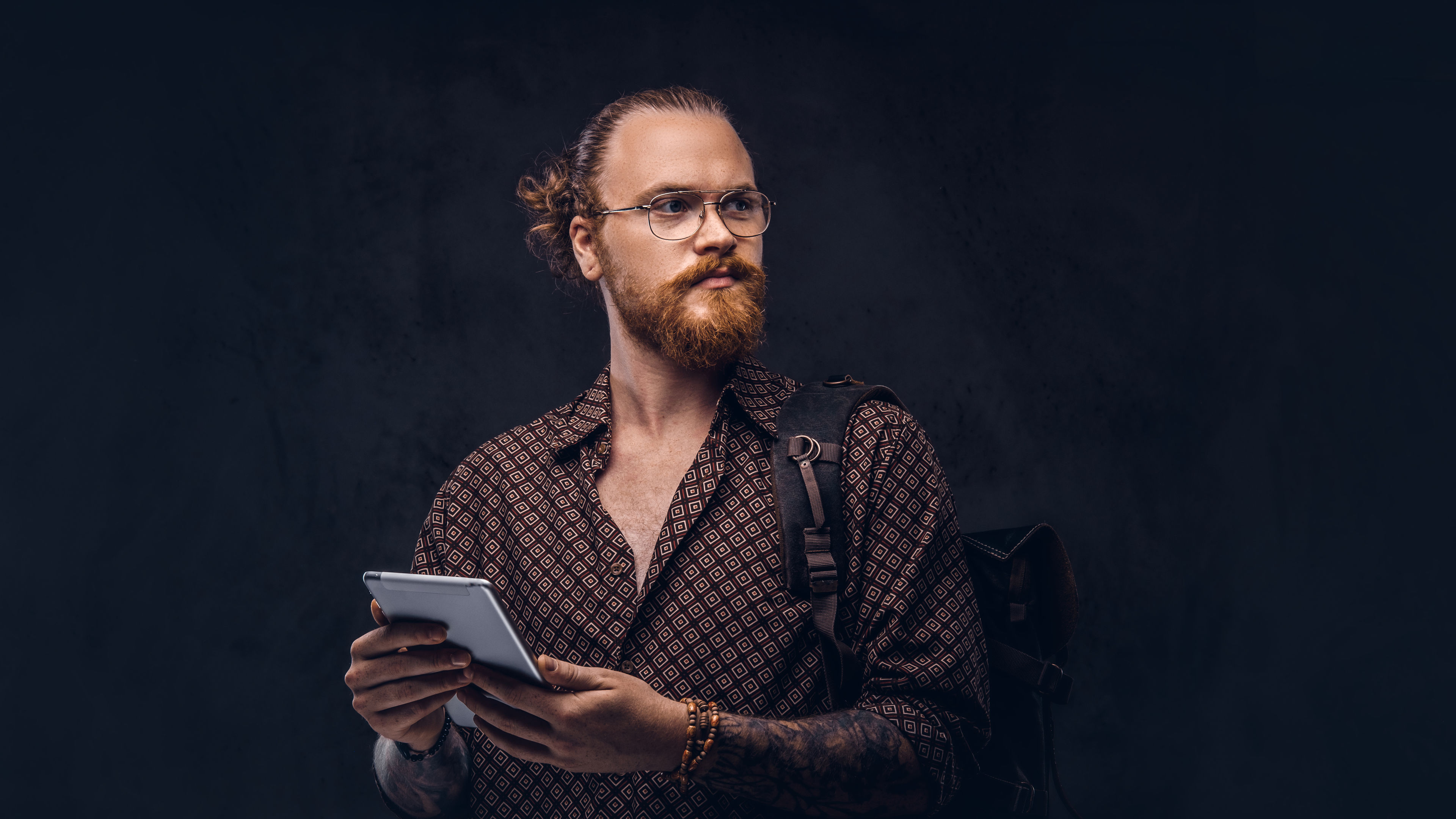A man with a tab in hand 
