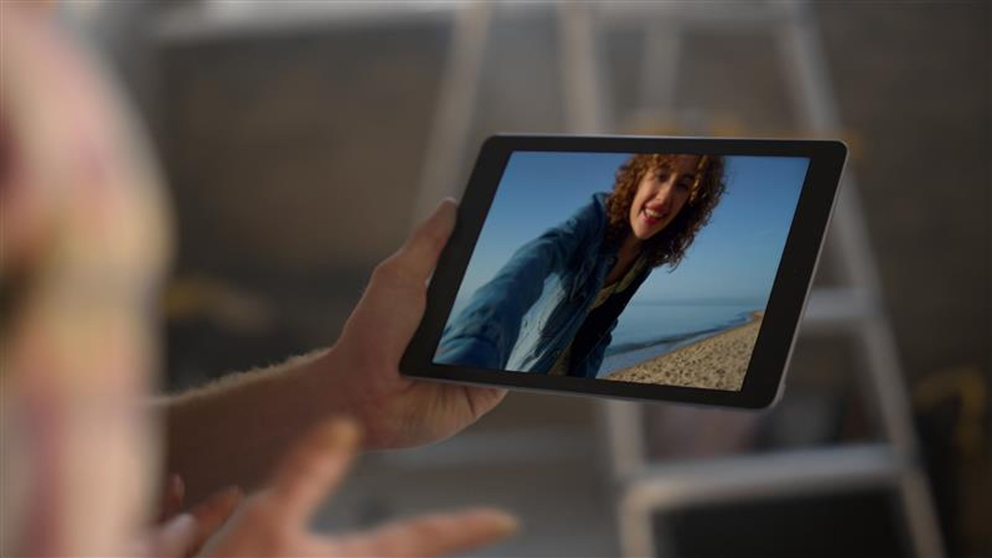 A person holding iPad