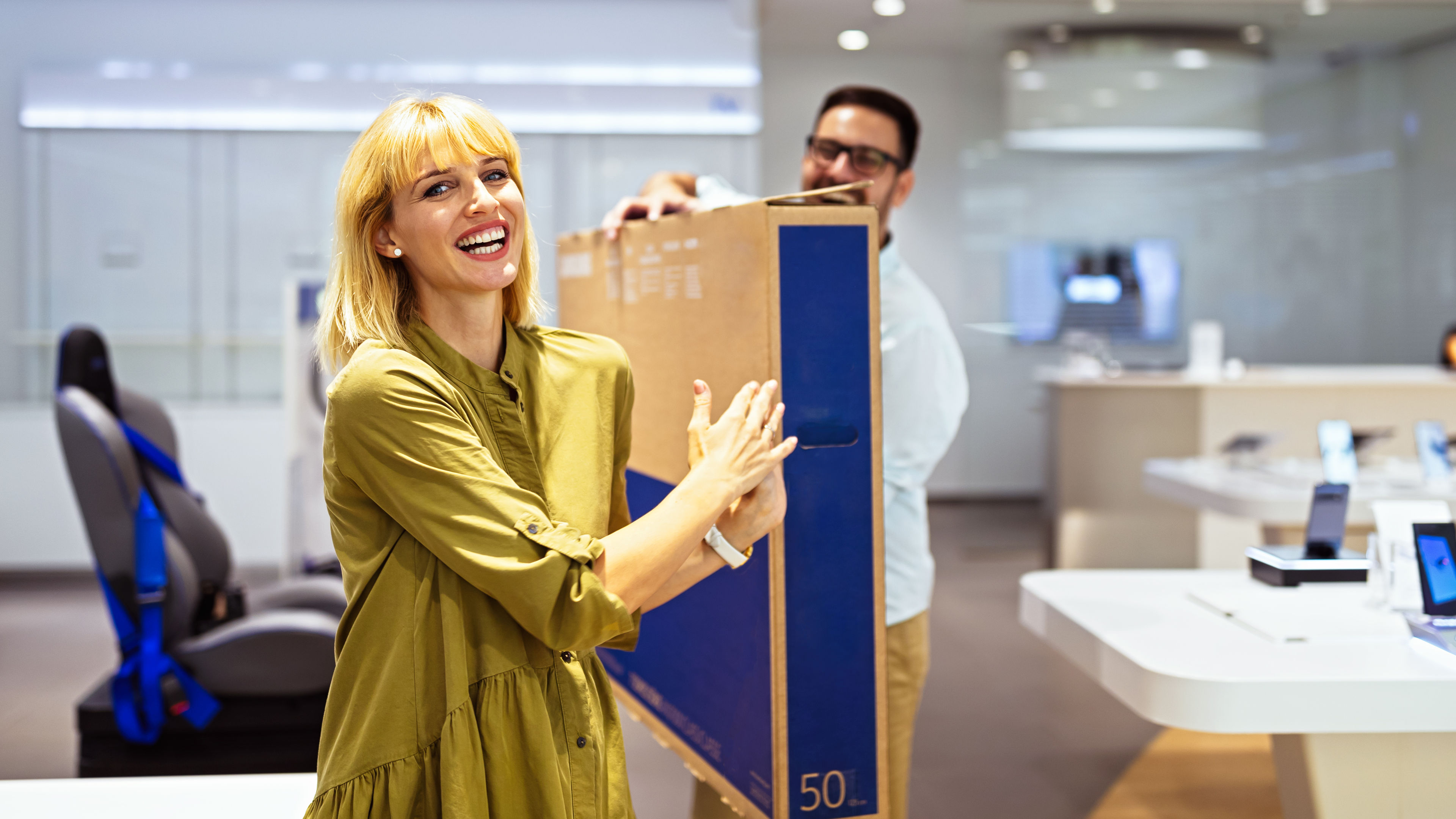 A woman buying TV