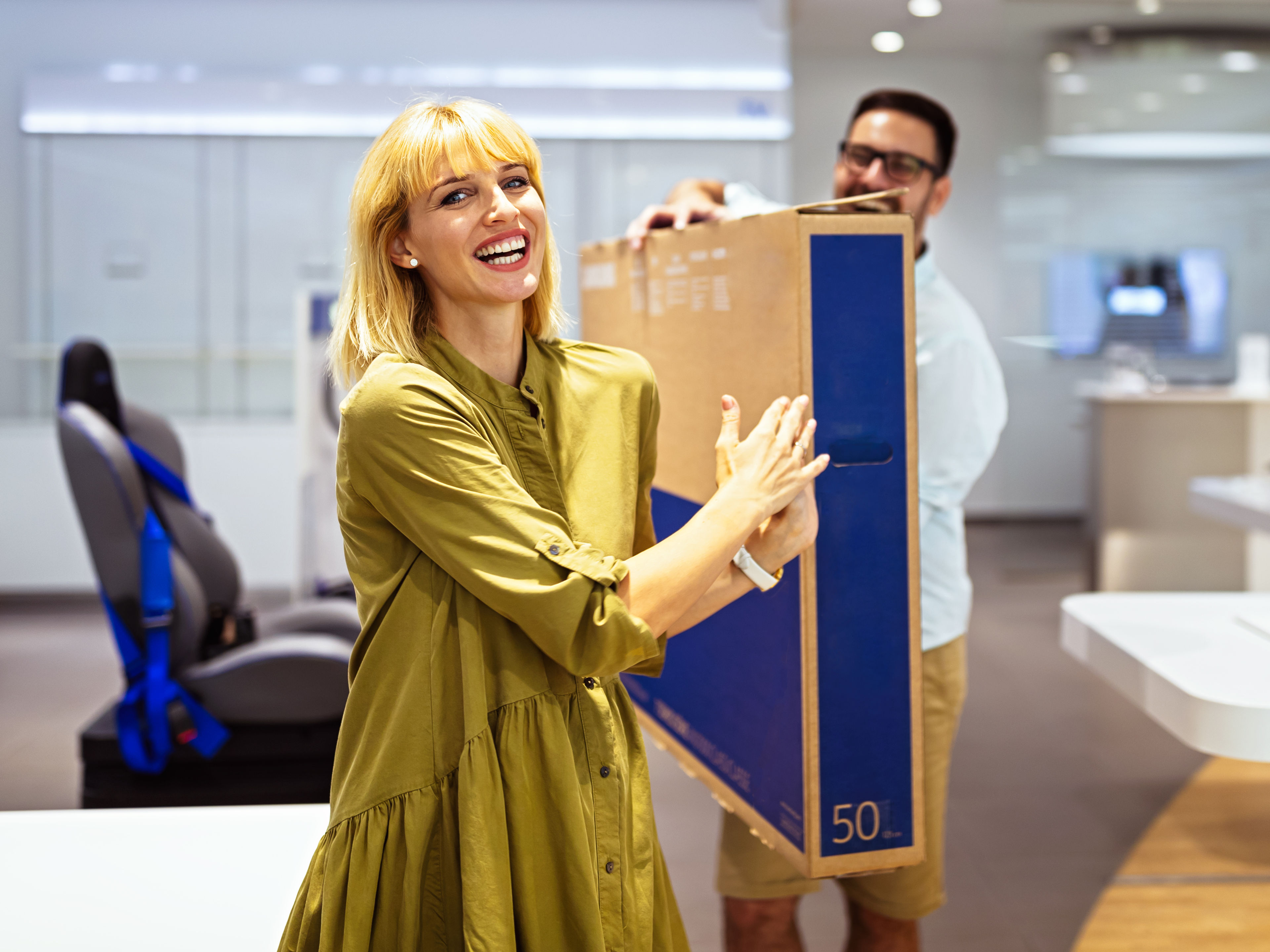 A woman buying TV 
