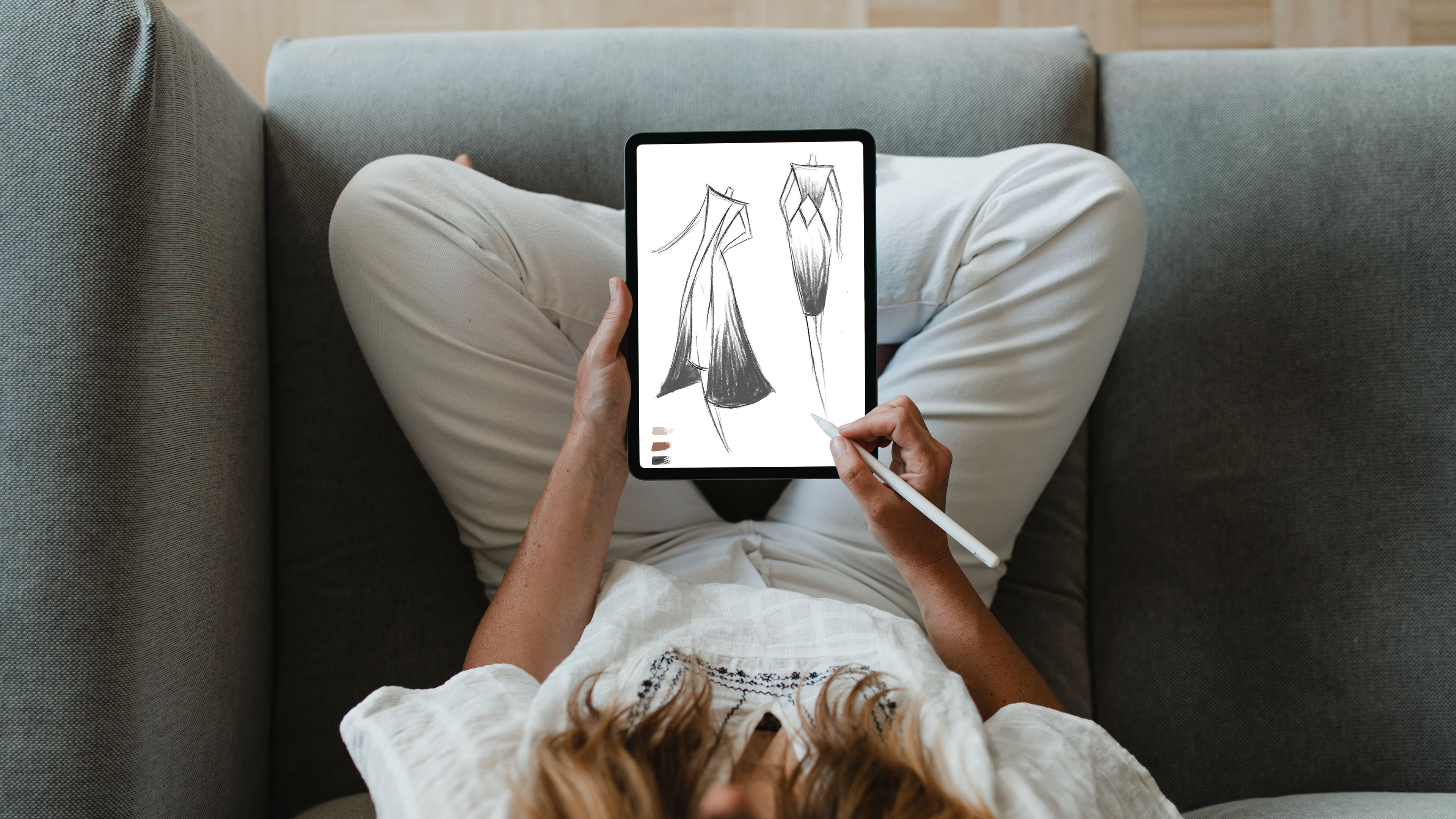 A woman drawing designs