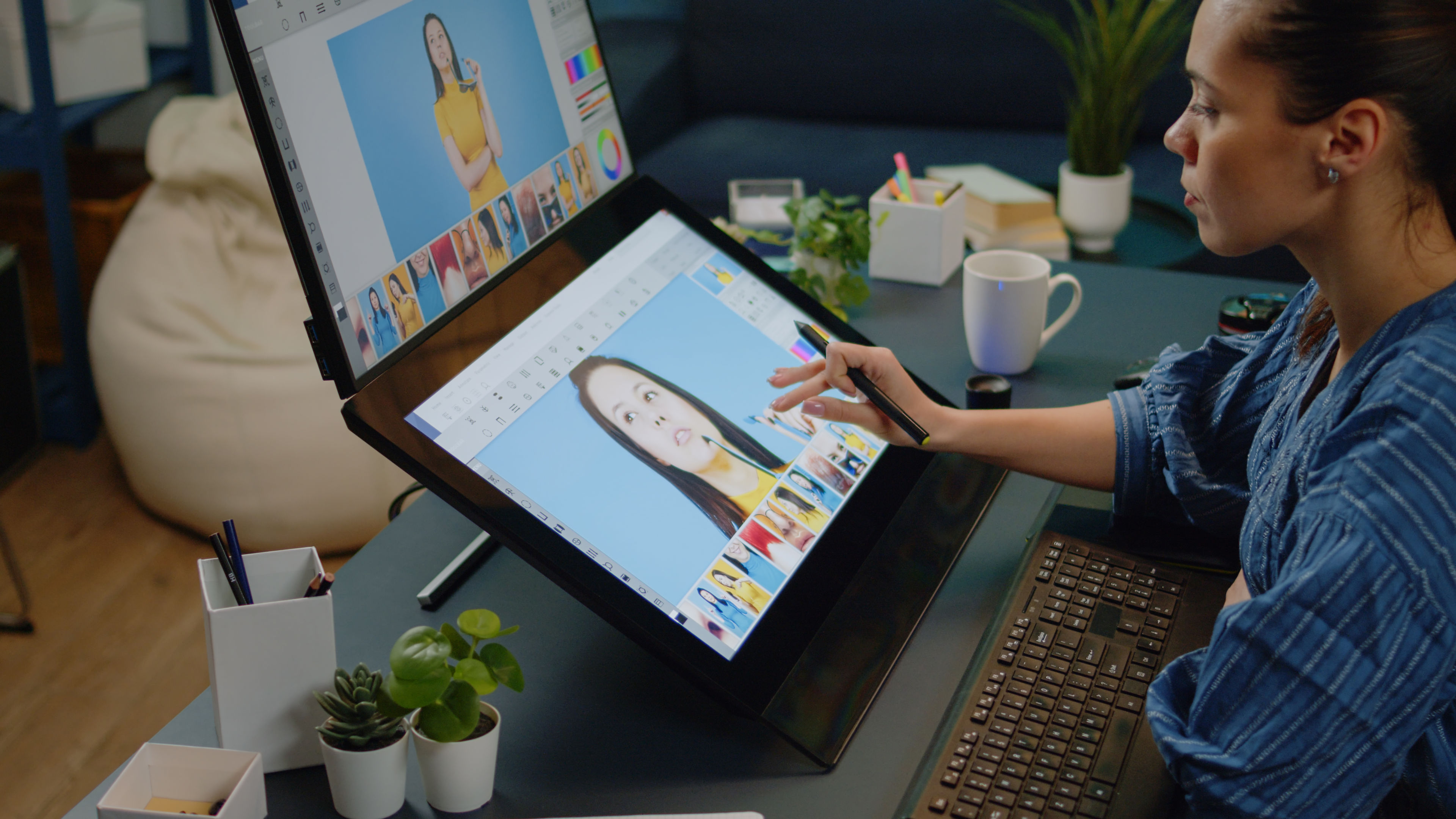 A woman drawing on tablet