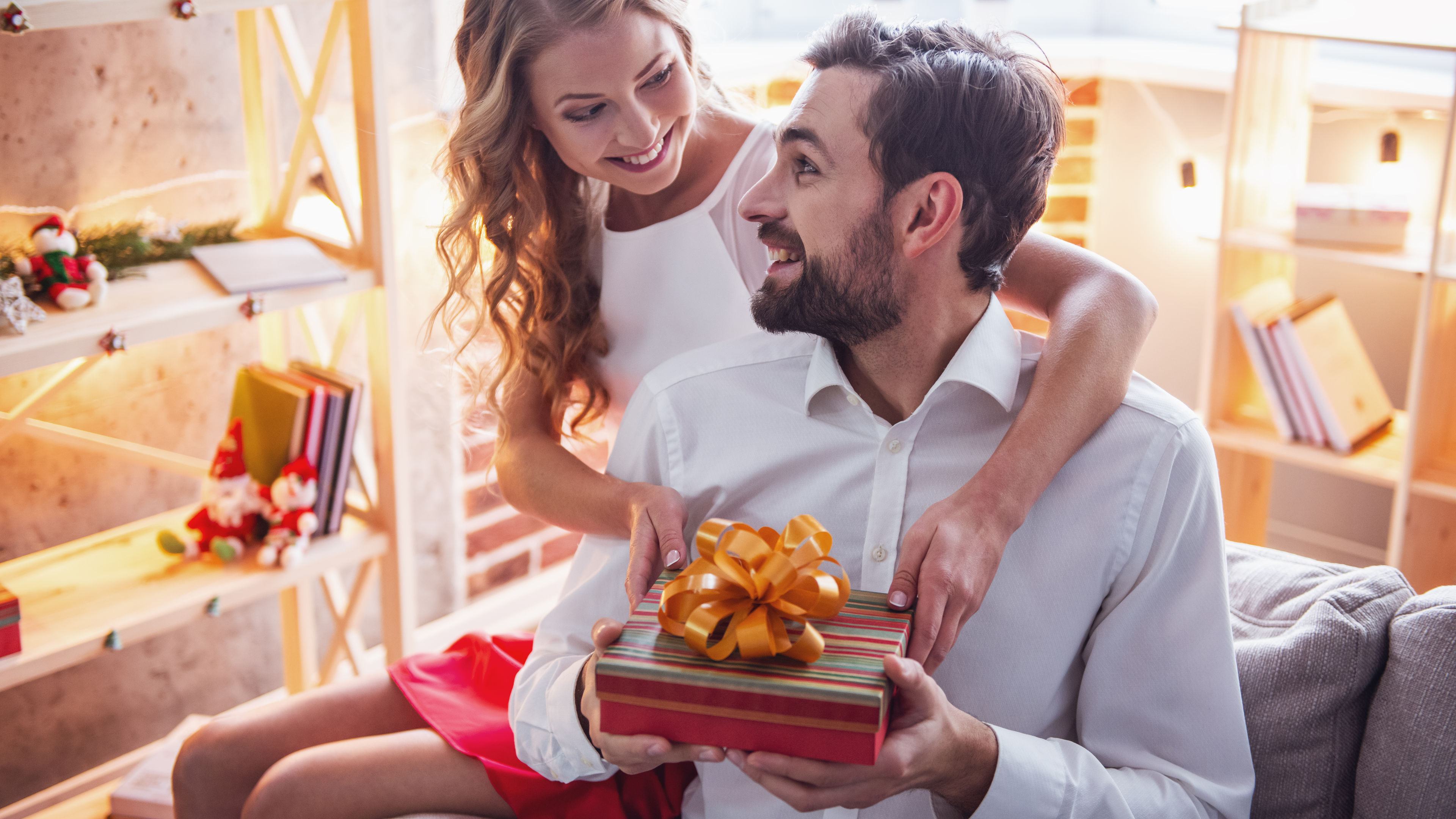 A woman giving her husband a hamper
