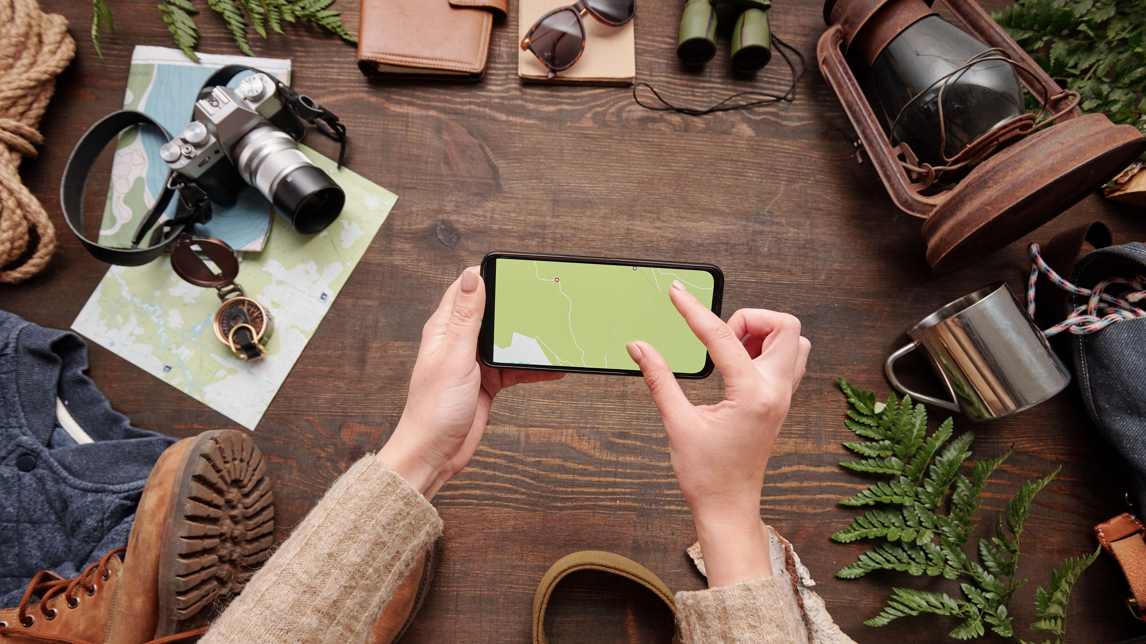 A woman is watching an online map on her smartphone