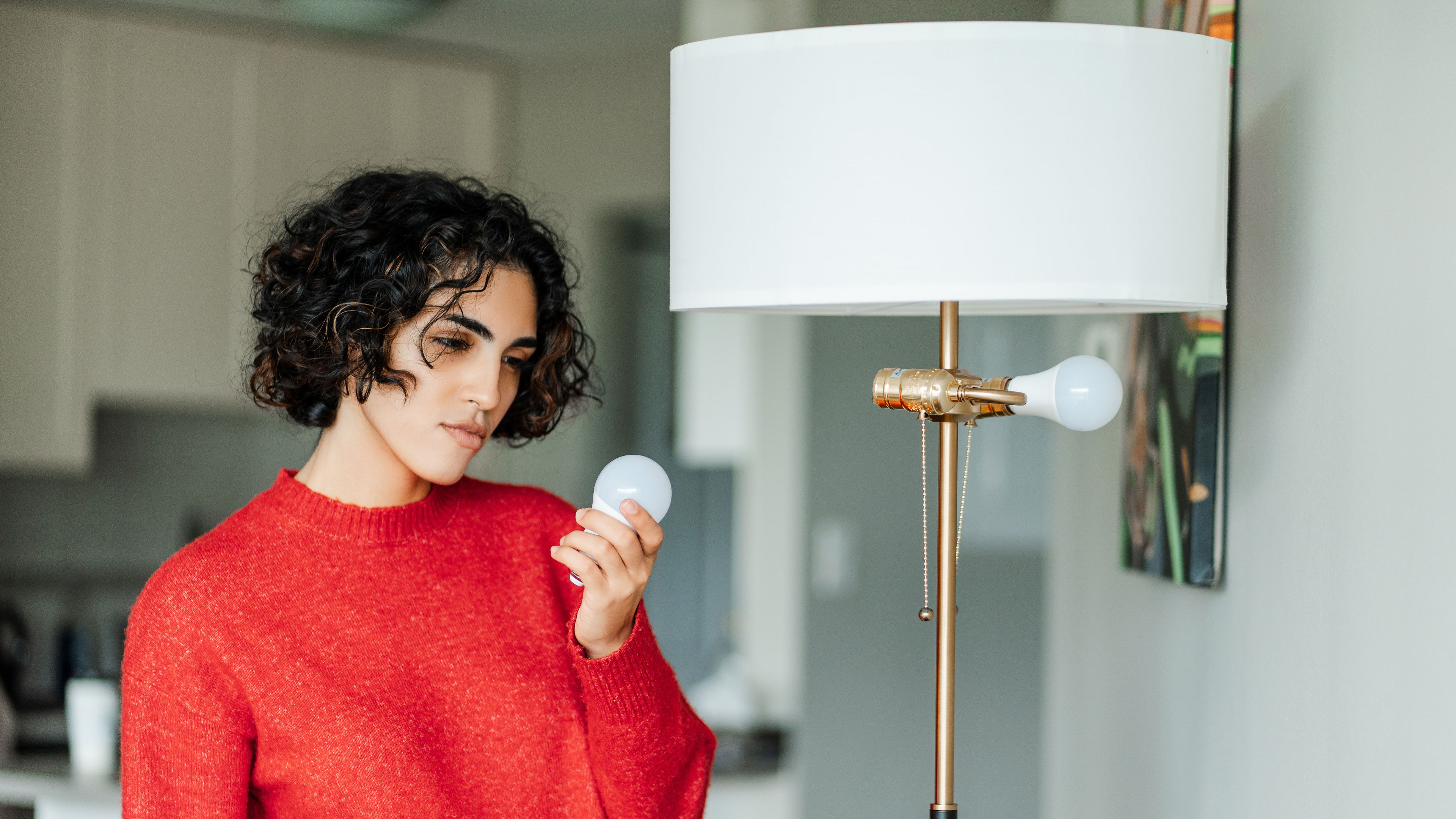 A woman looking at a bulb
