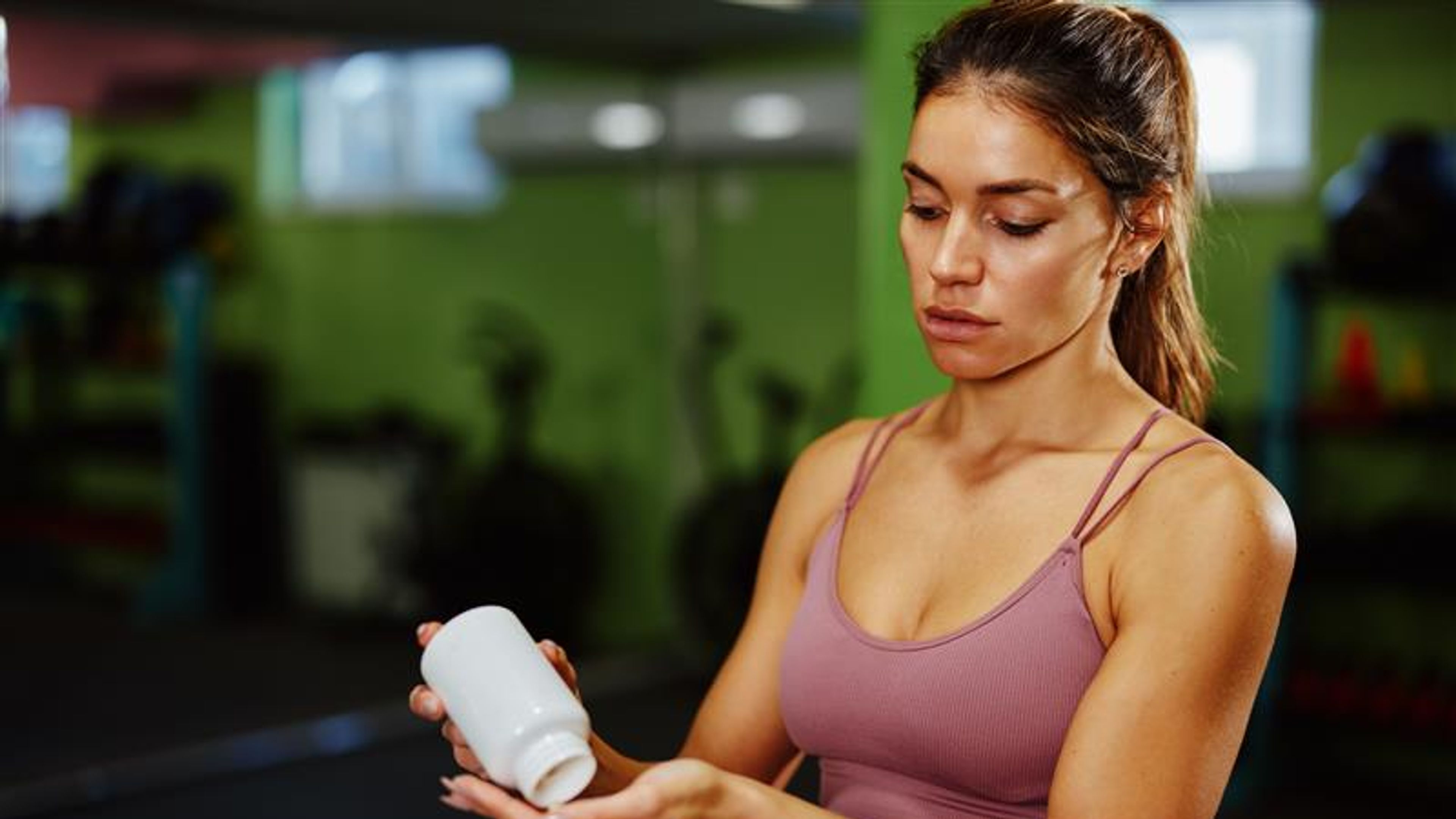 A woman taking protein powder