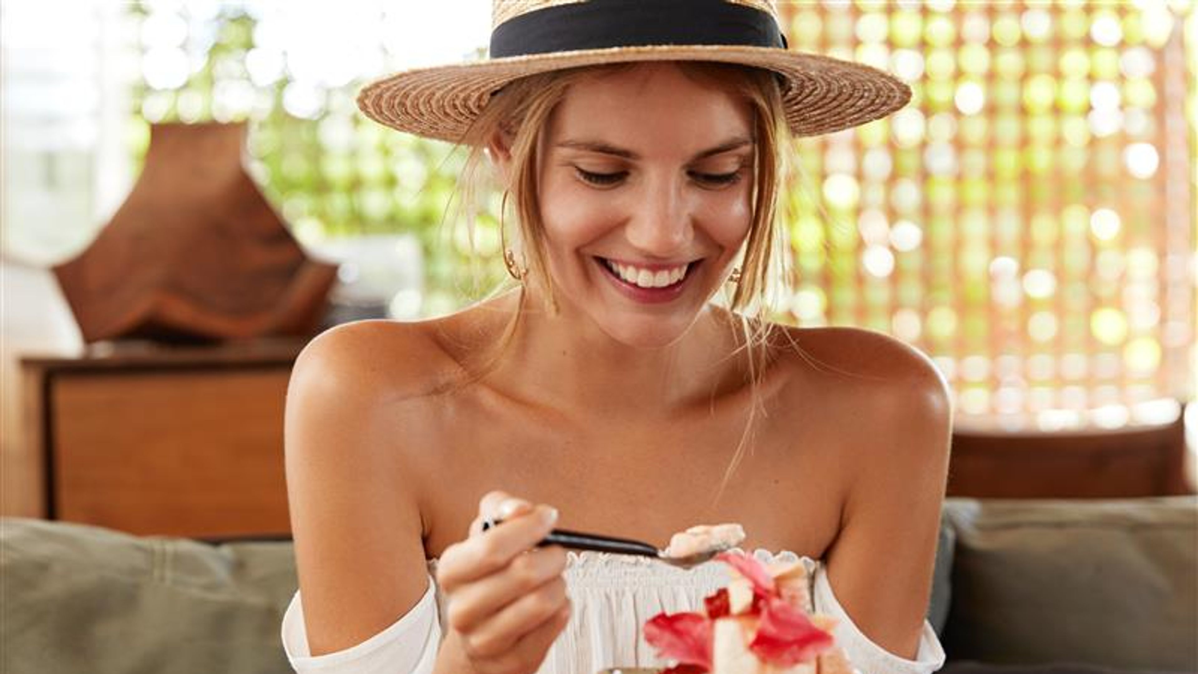 A Woman tasting dessert