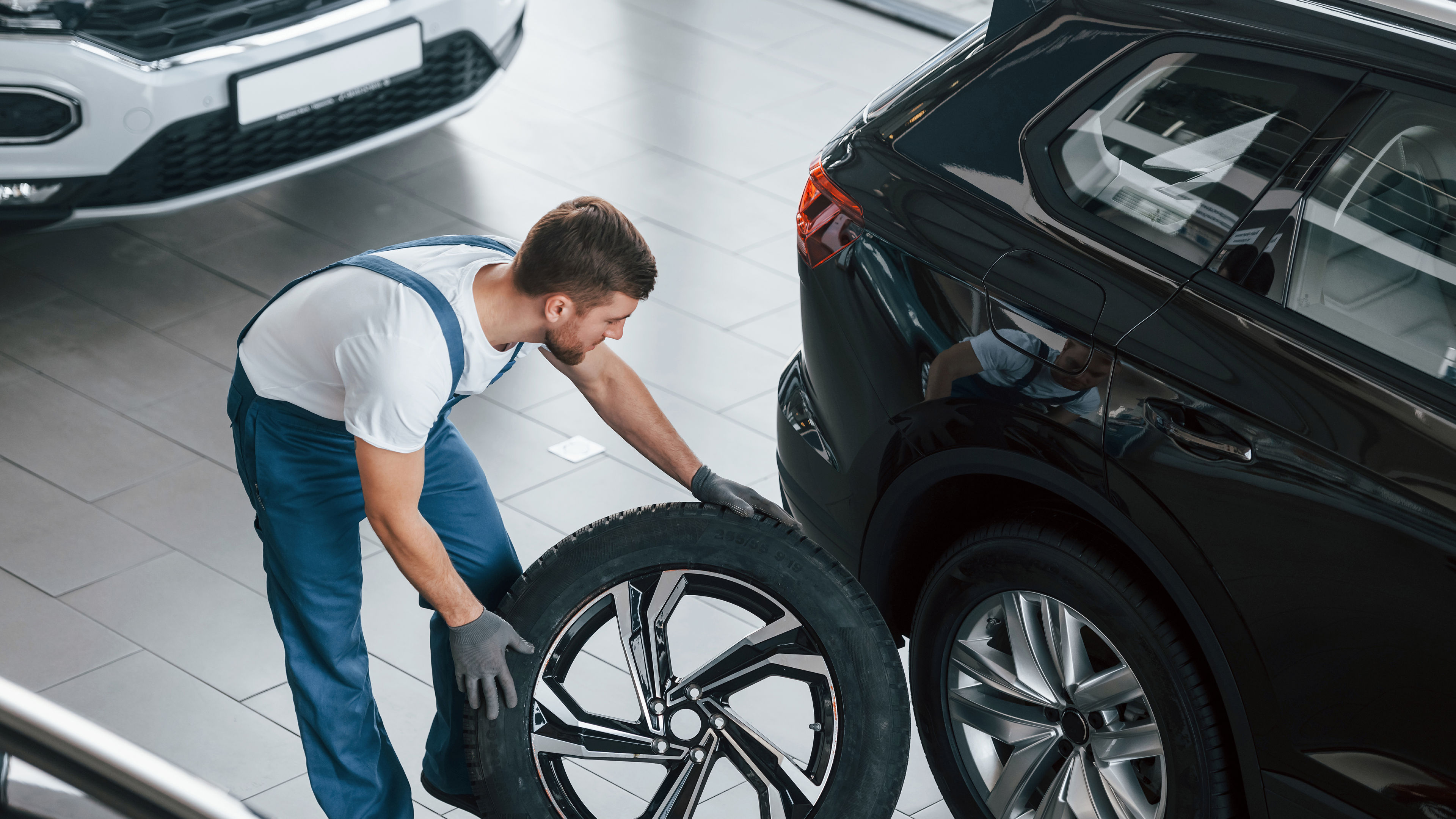 Auto Mechanic with Tire