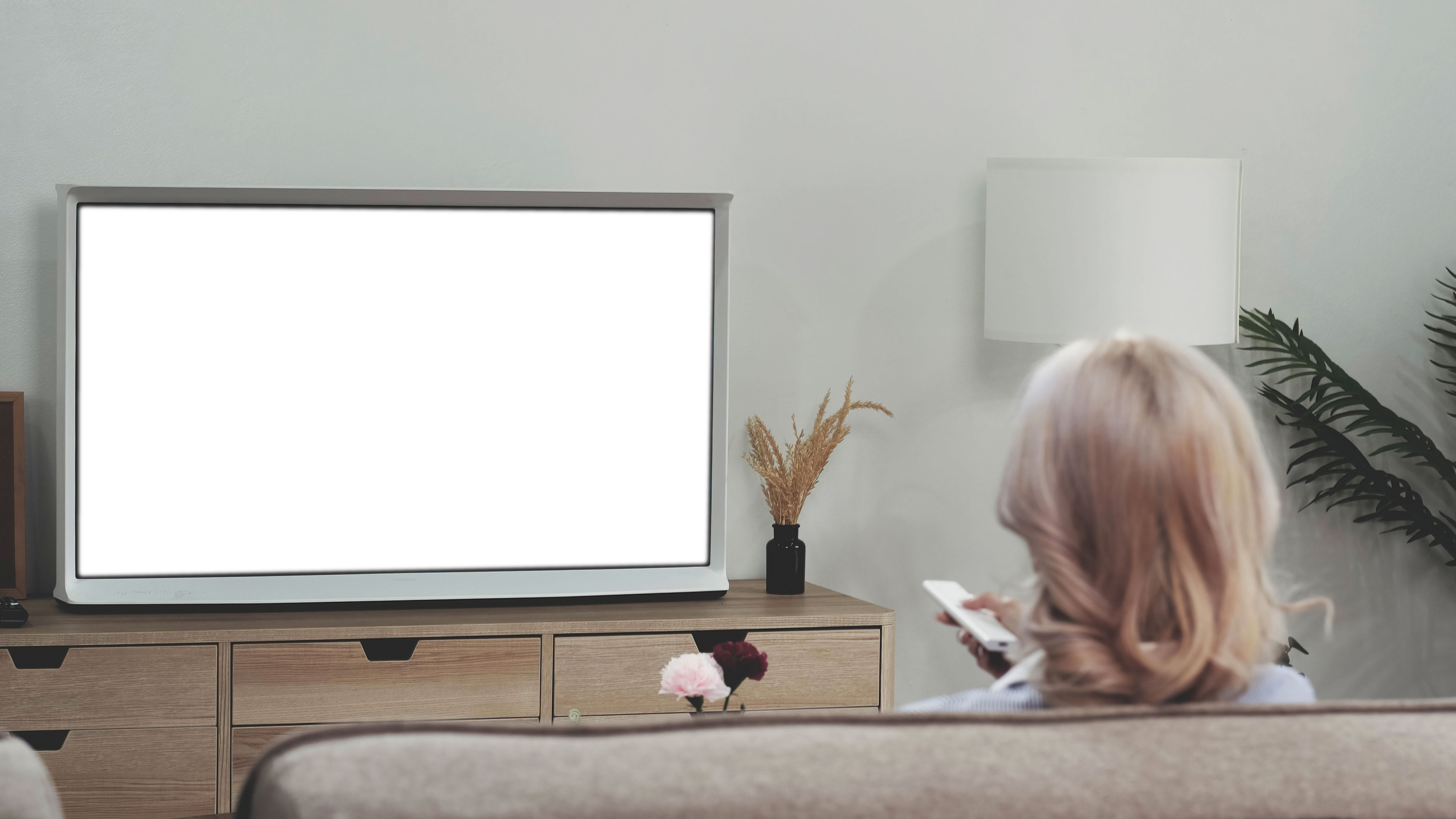 Behind of woman watching tv