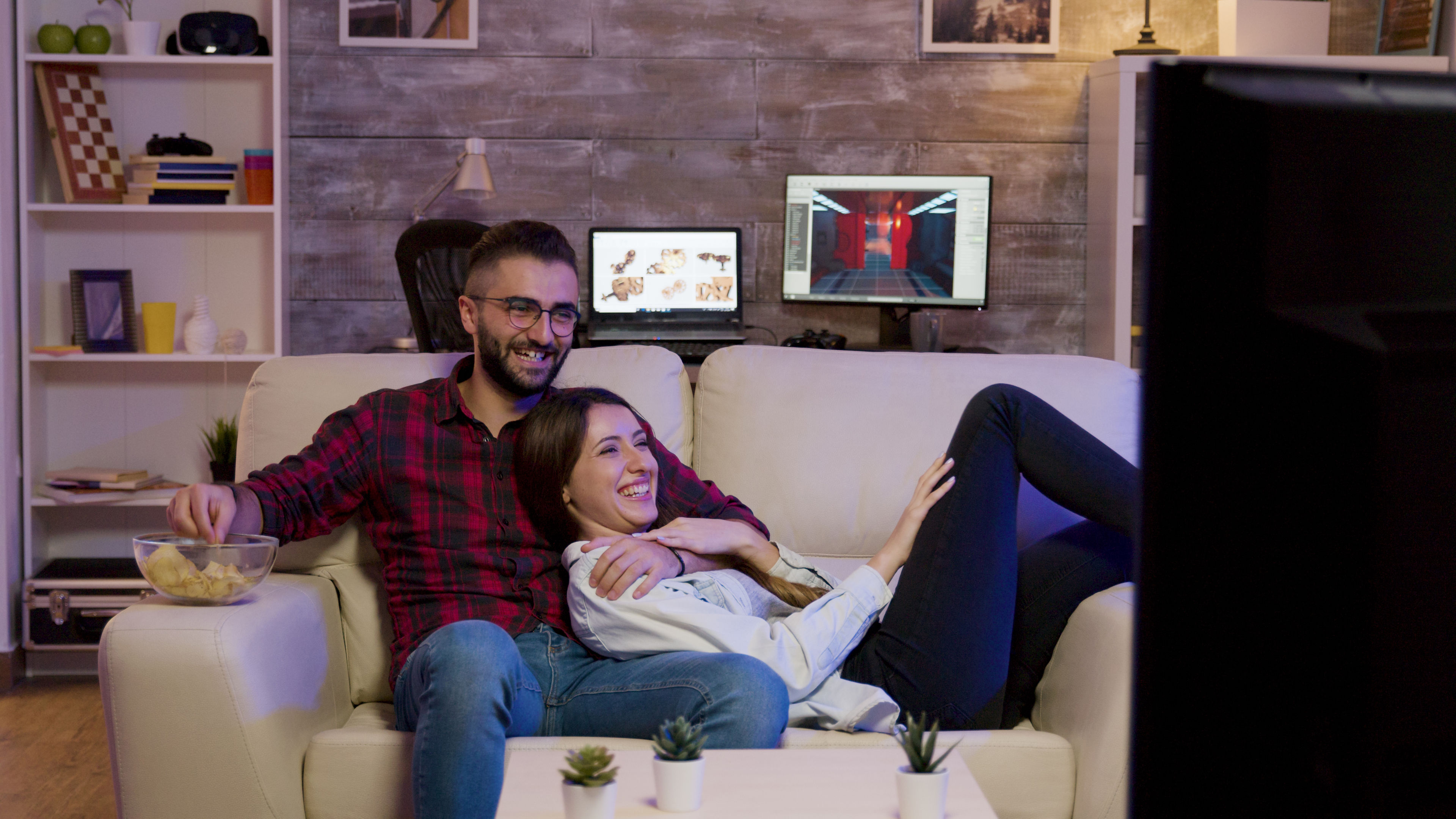 Charming couple lying on the couch