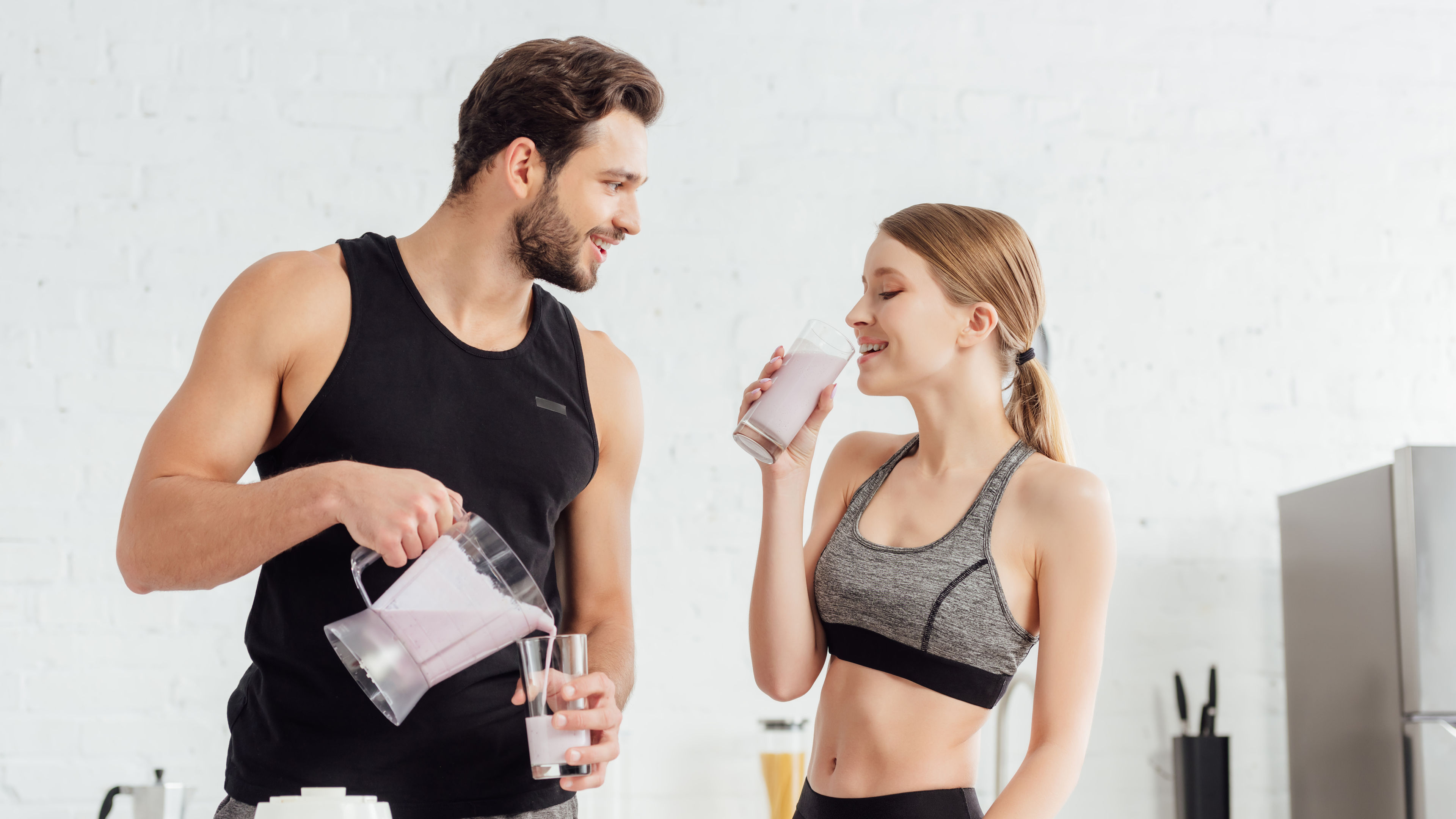 Couple making protein drinks