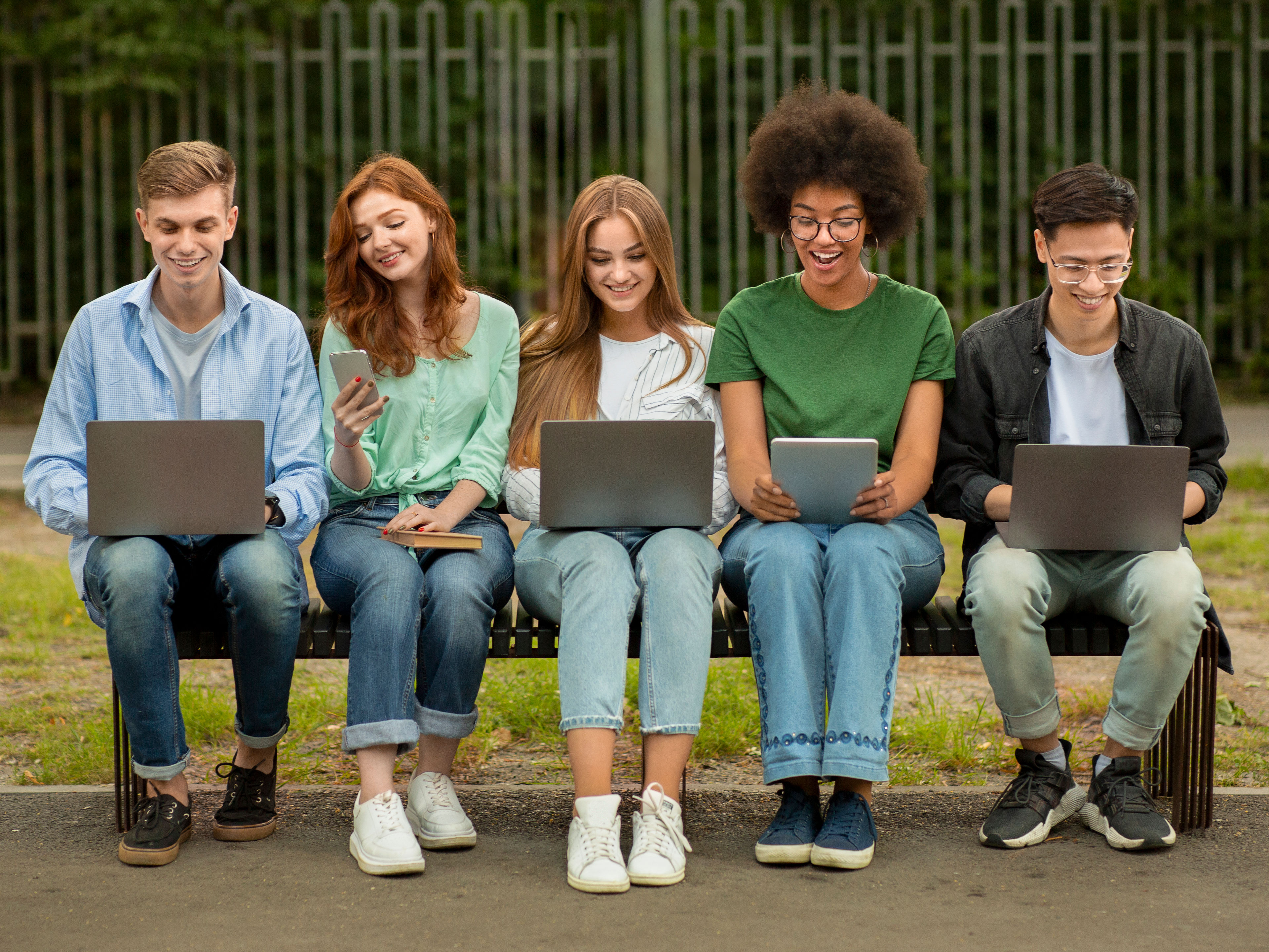 Diverse Teenage Students with gadgets 