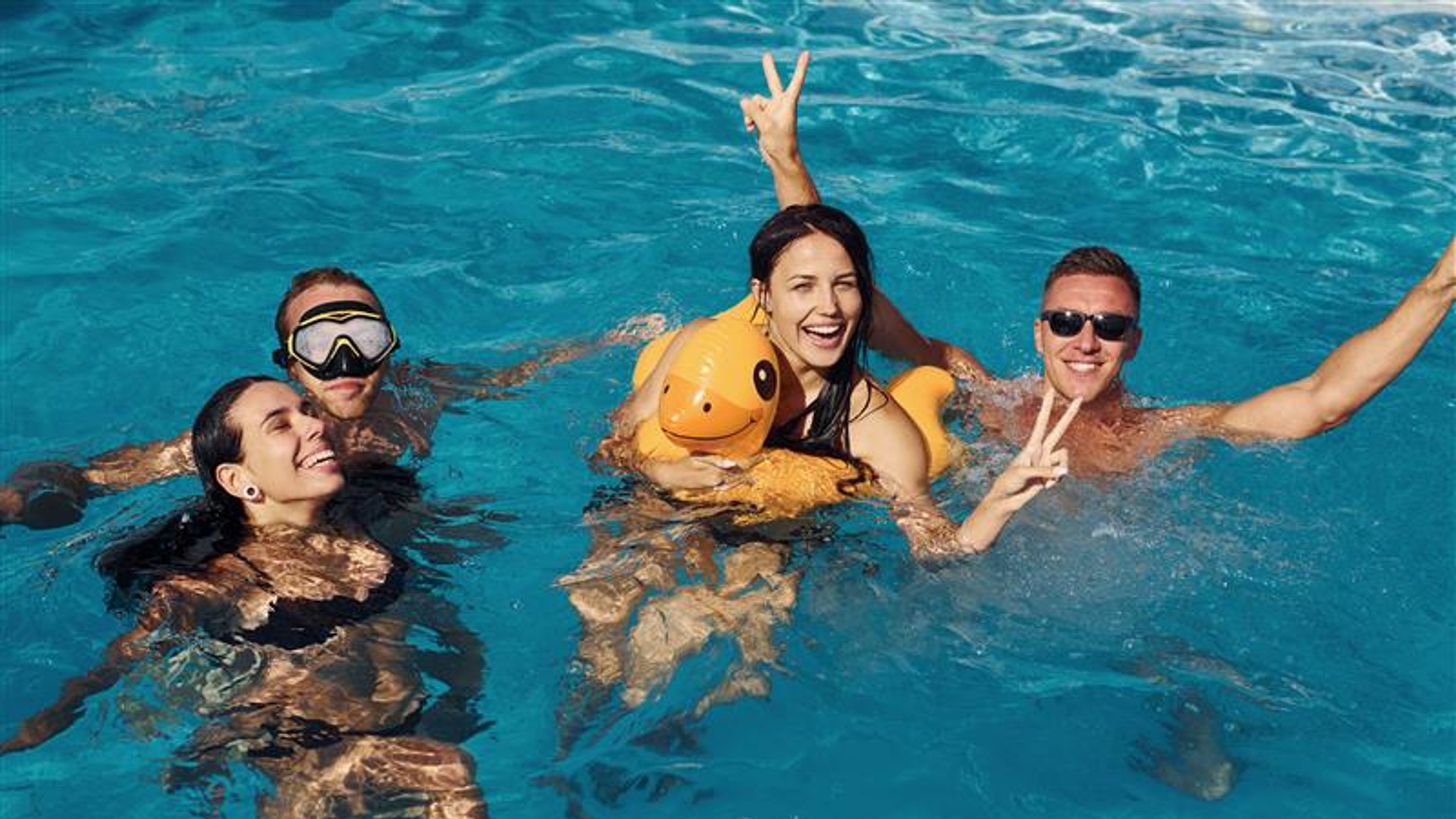 Friends enjoying on the pool
