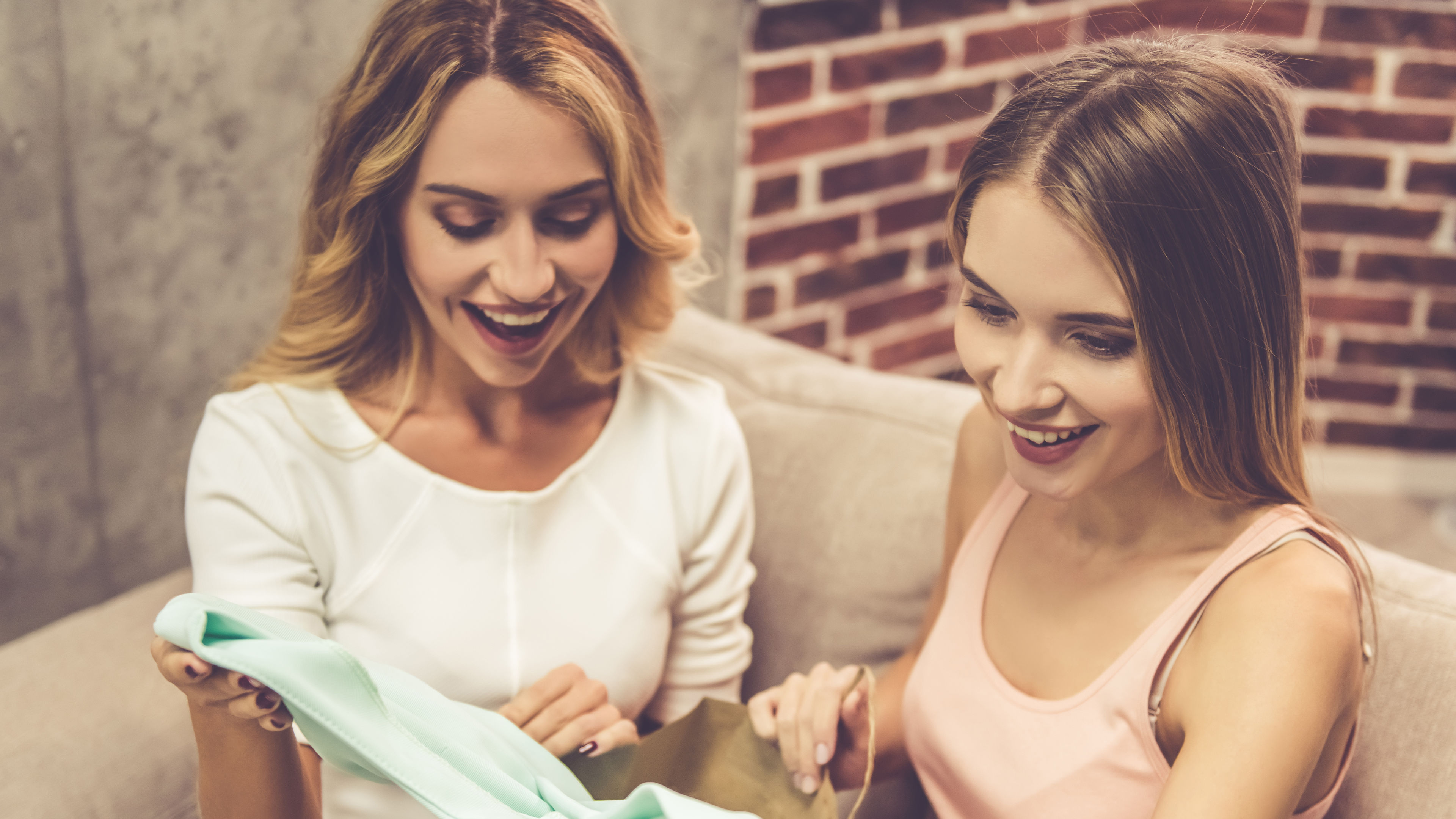 Friends looking at a shopping bag