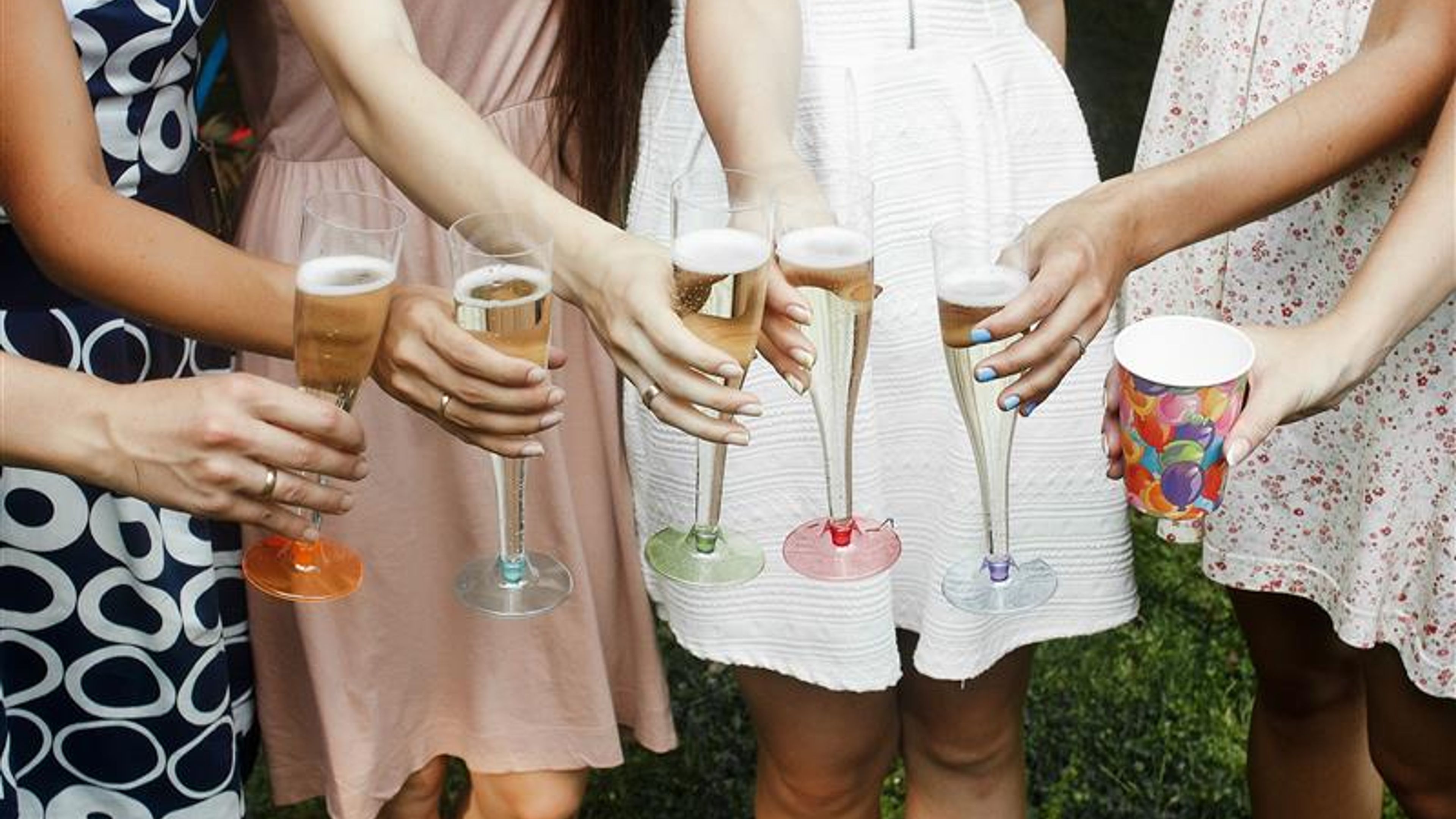 Girls holding glasses