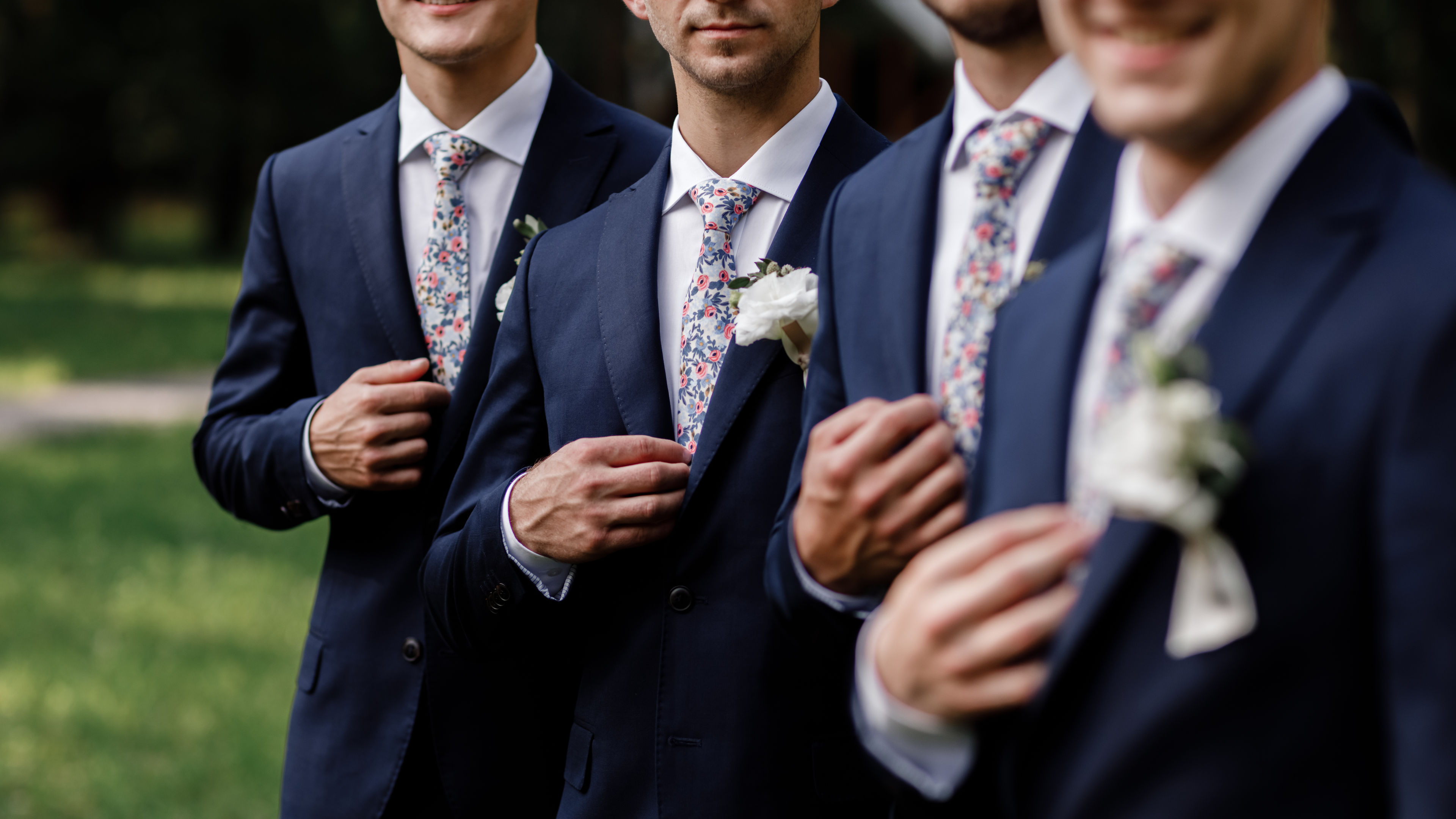 Groomsmen in Navy Suits and Floral Ties