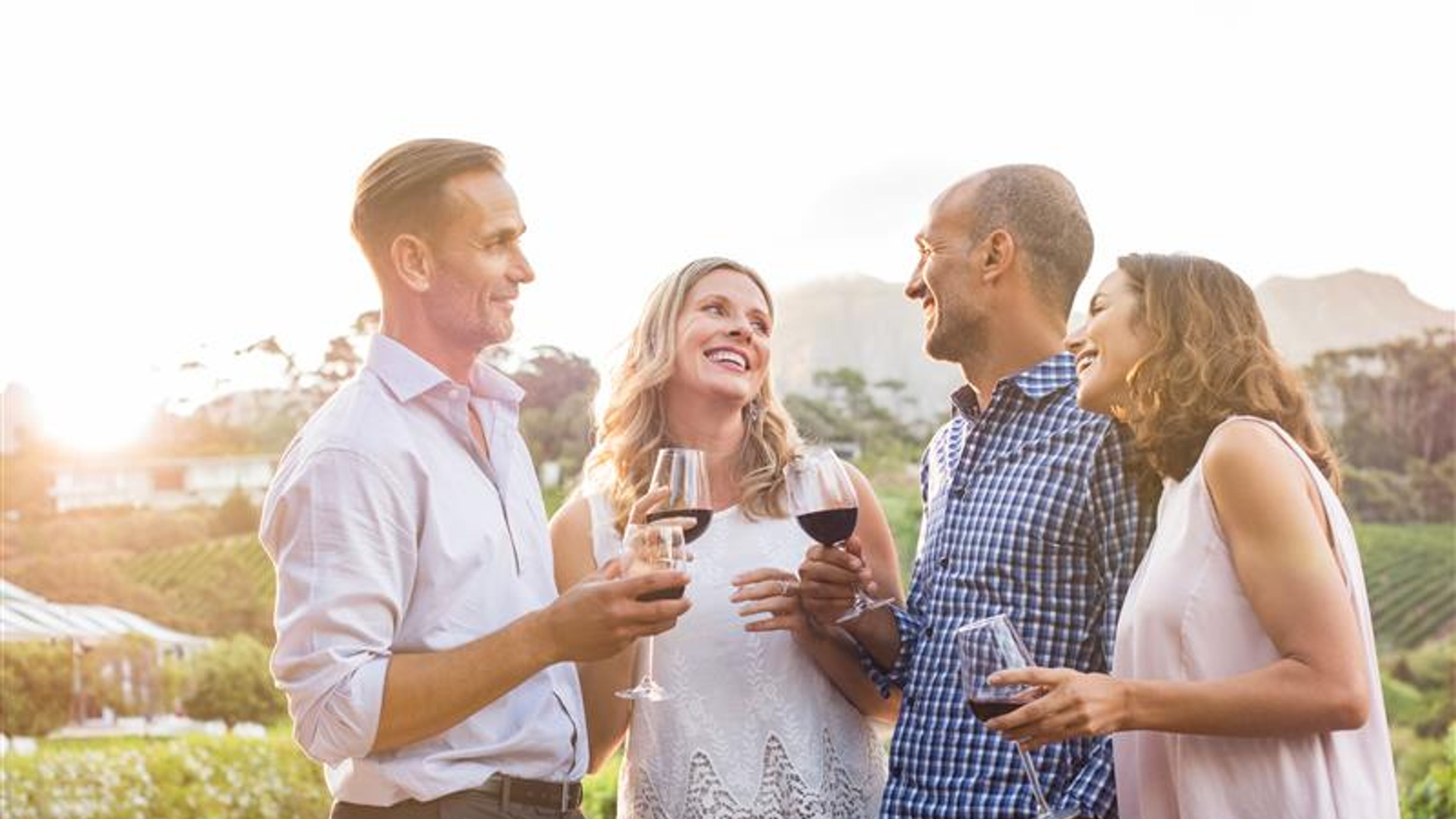 Happy friends drinking wine