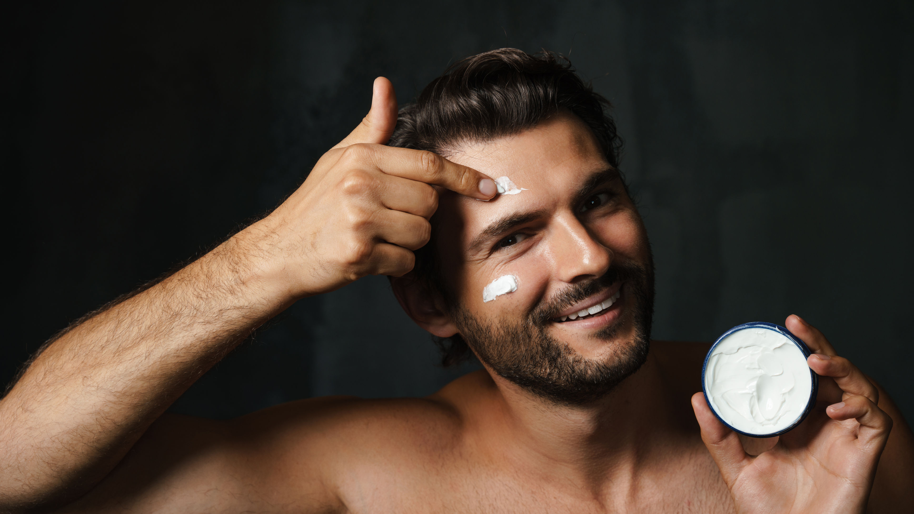 Man Applying Facial Cream 