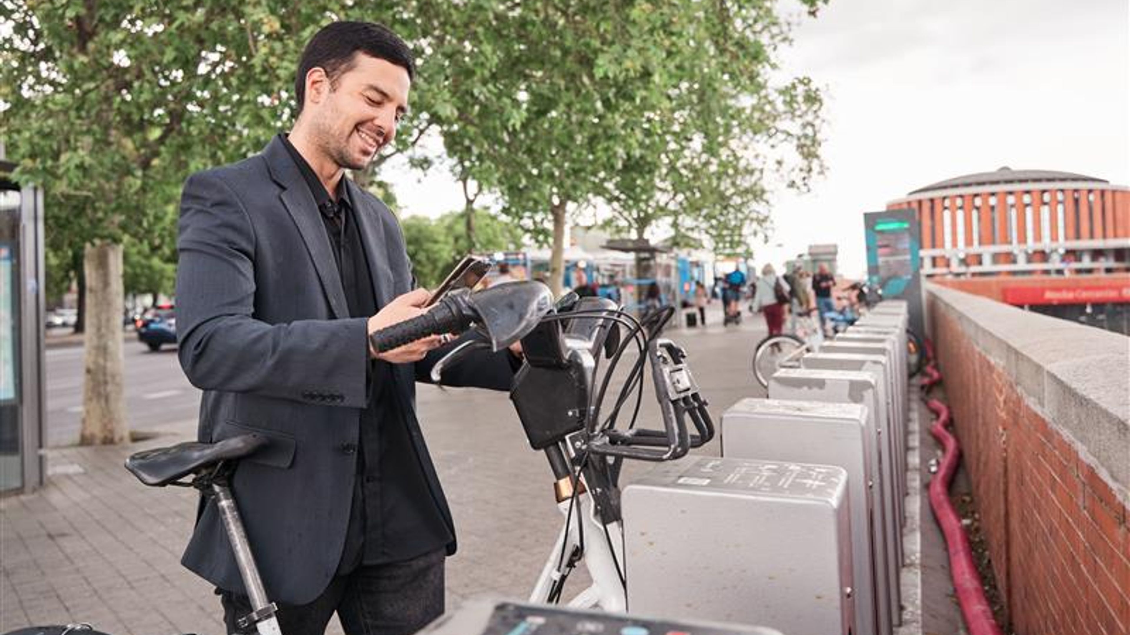 Man in suit with e-bike