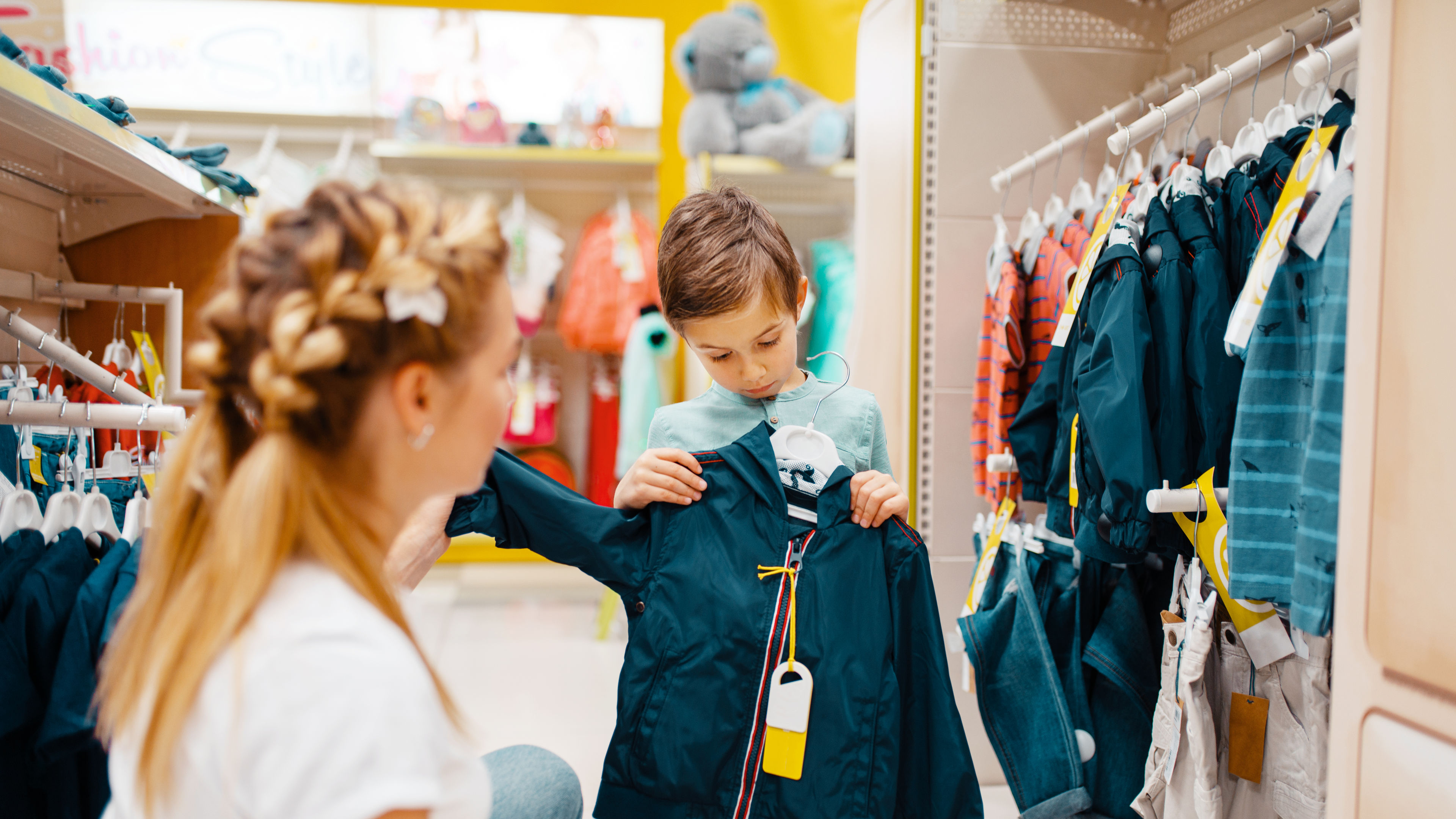 Mom and child buying jacket