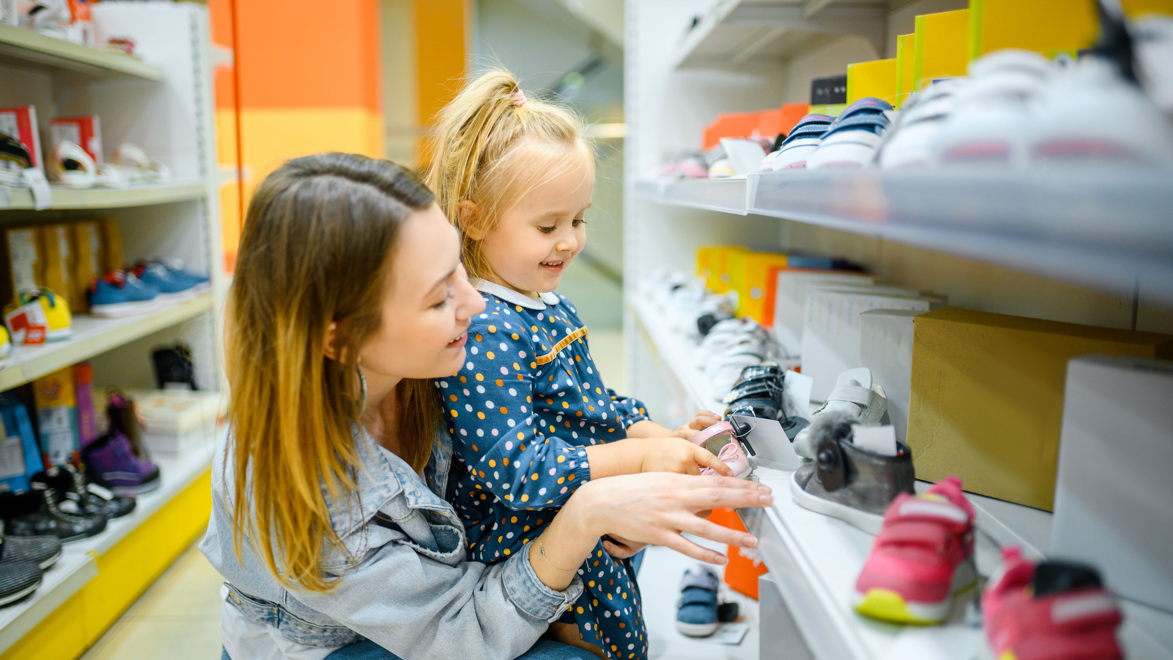mother and baby looking on shoes
