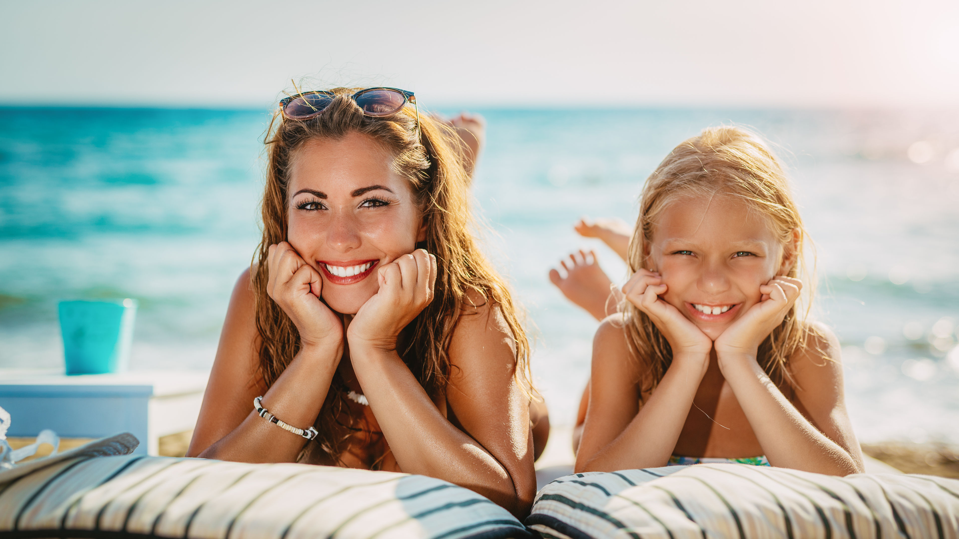 Mother and daughter on the beach 