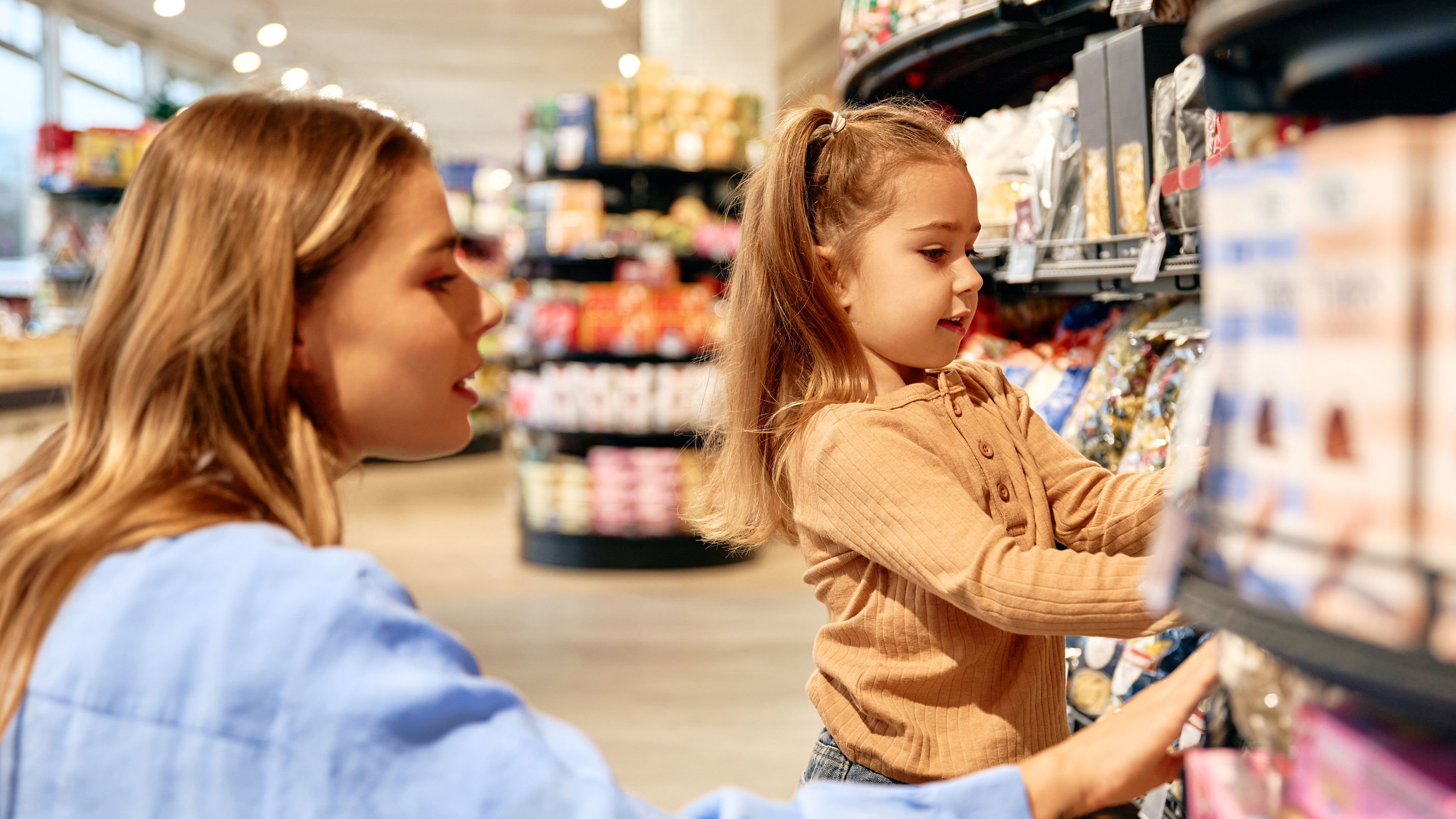 Mother and daughter shopping together