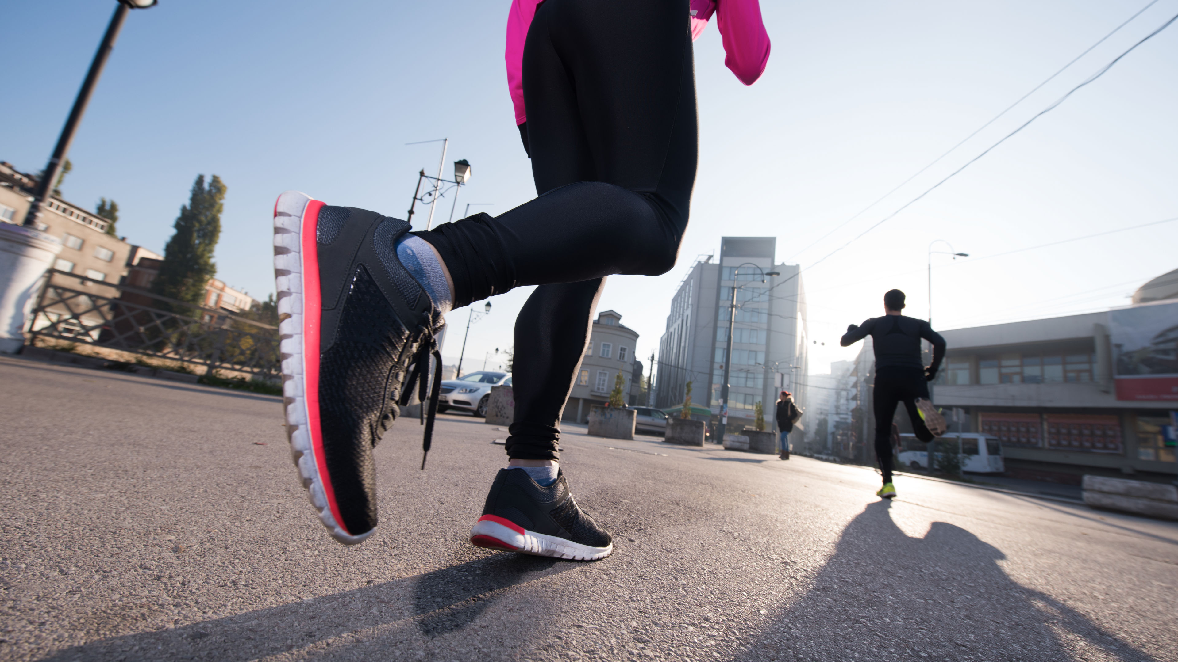 People Jogging on a City Street