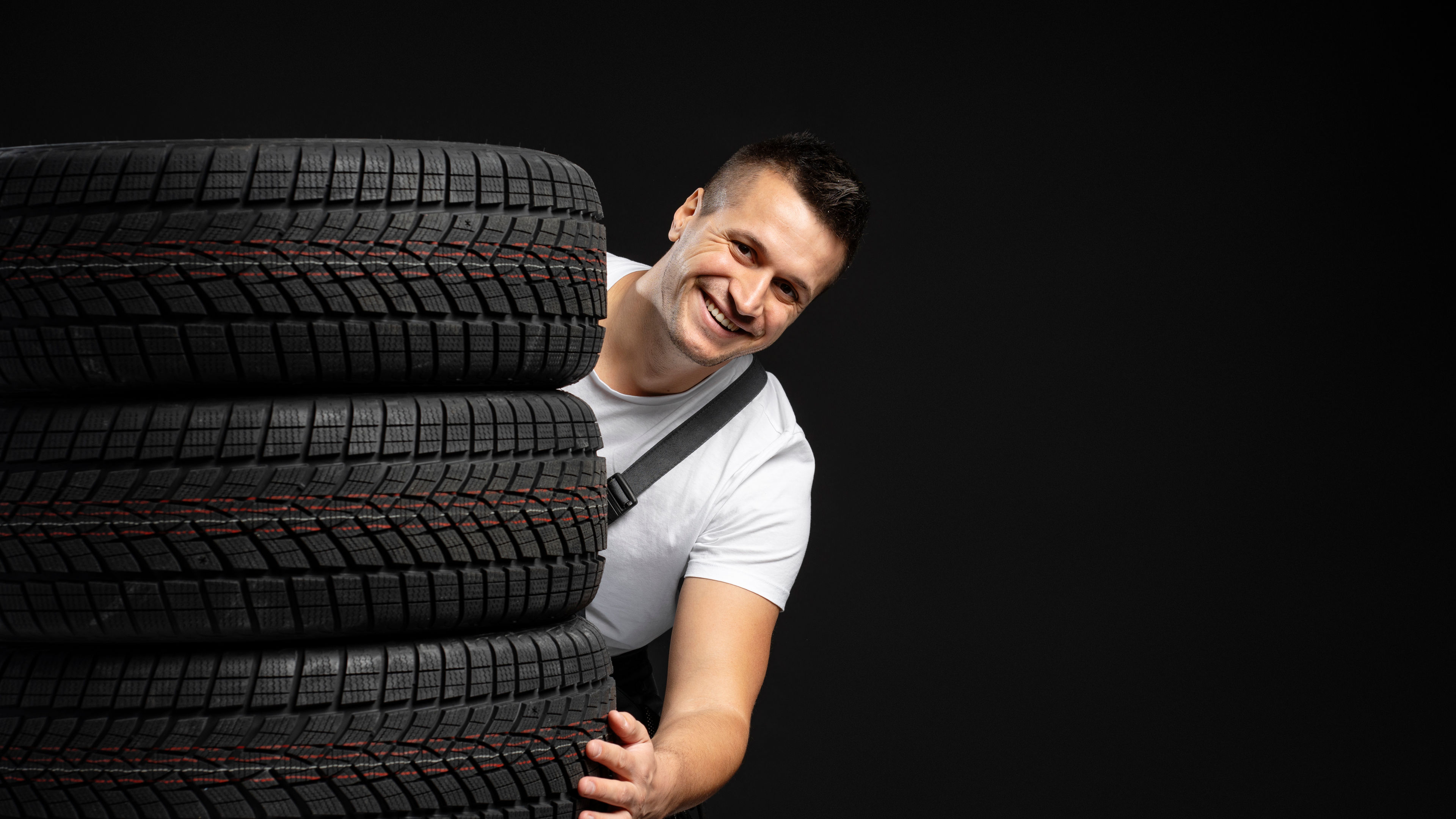 Smiling Man with Black Tyre