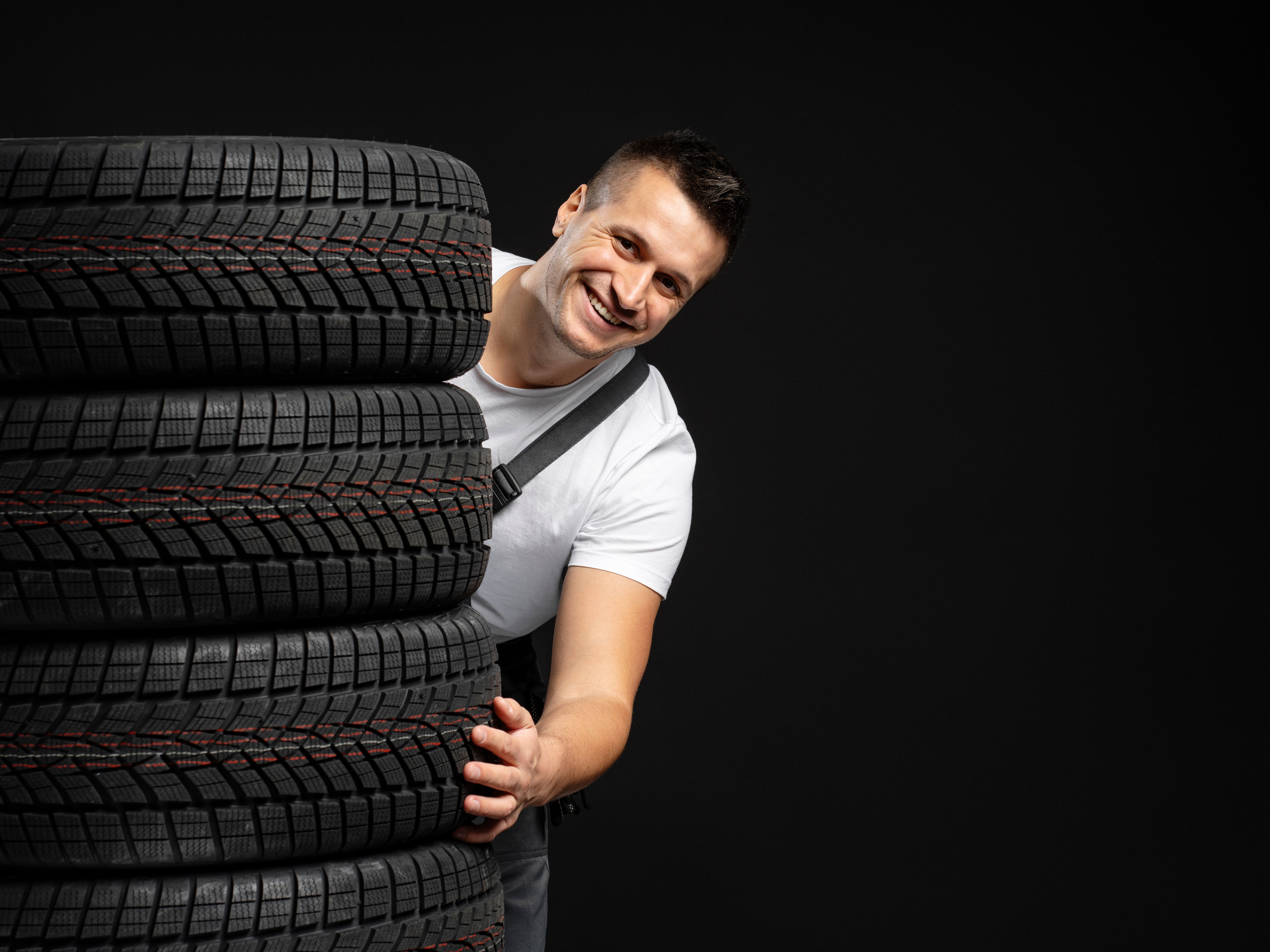Smiling Man with Black Tyre 