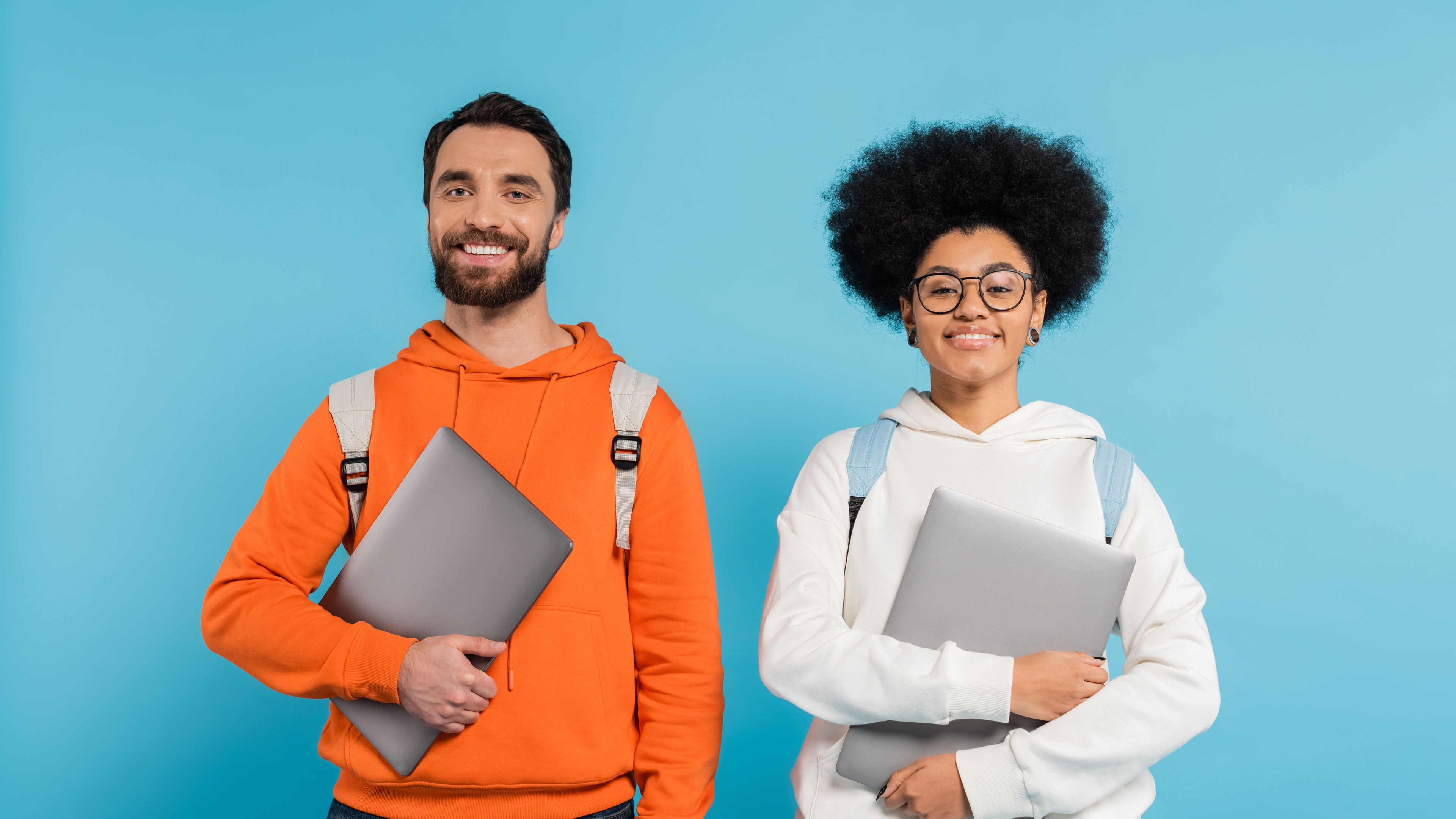 Smiling Students with Laptops