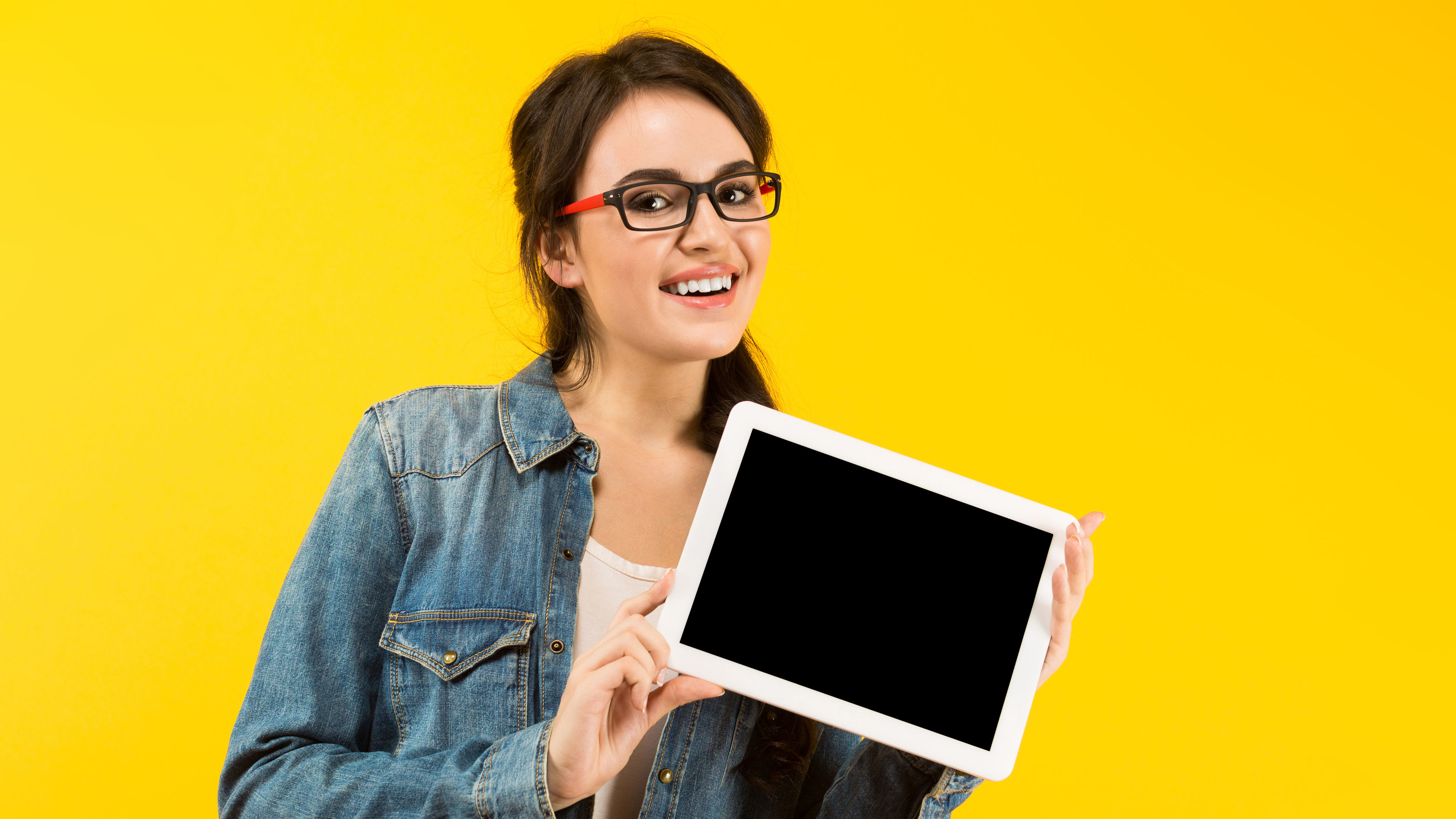 Smiling Woman Holding Tablet