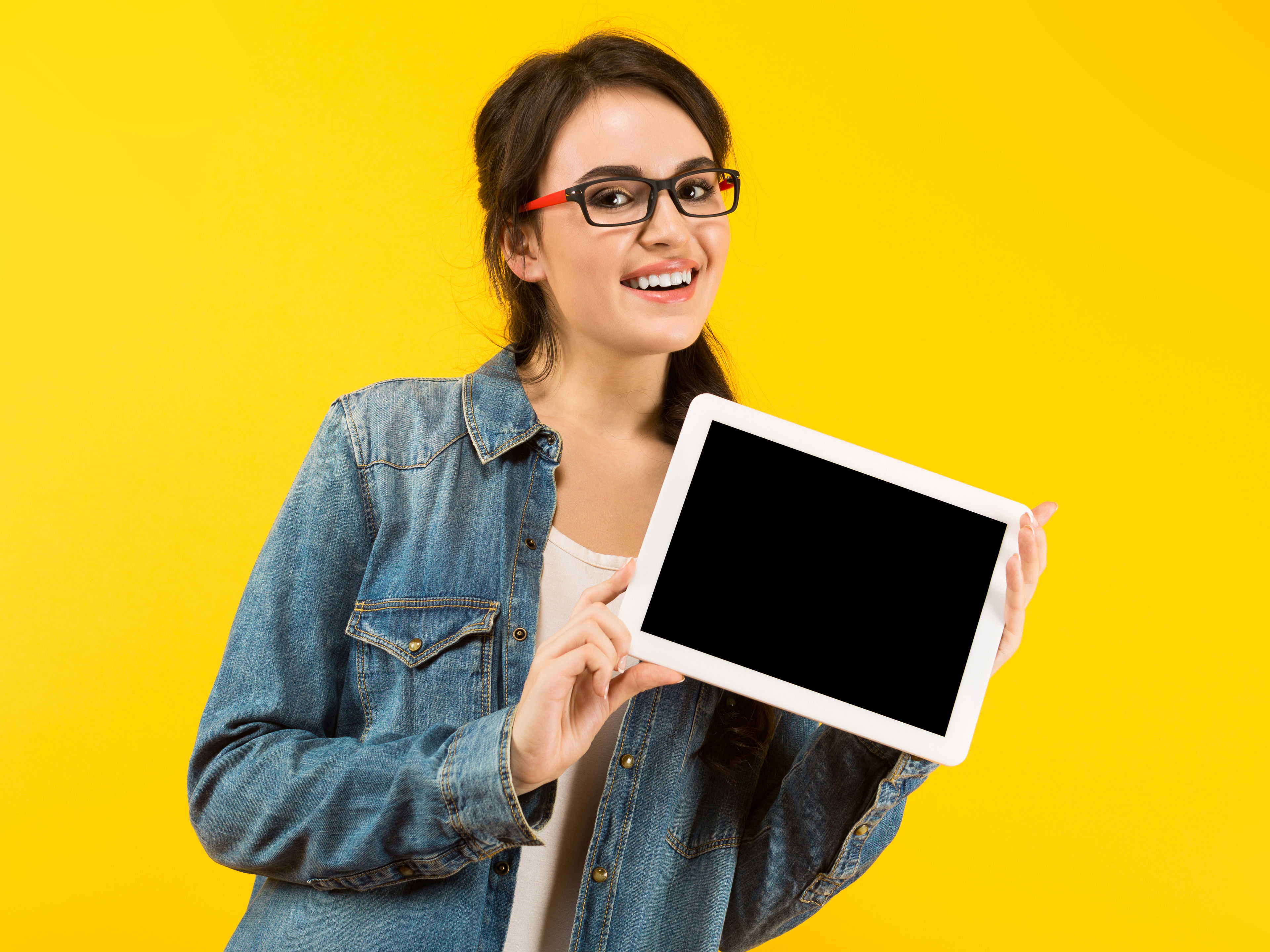 Smiling Woman Holding Tablet 