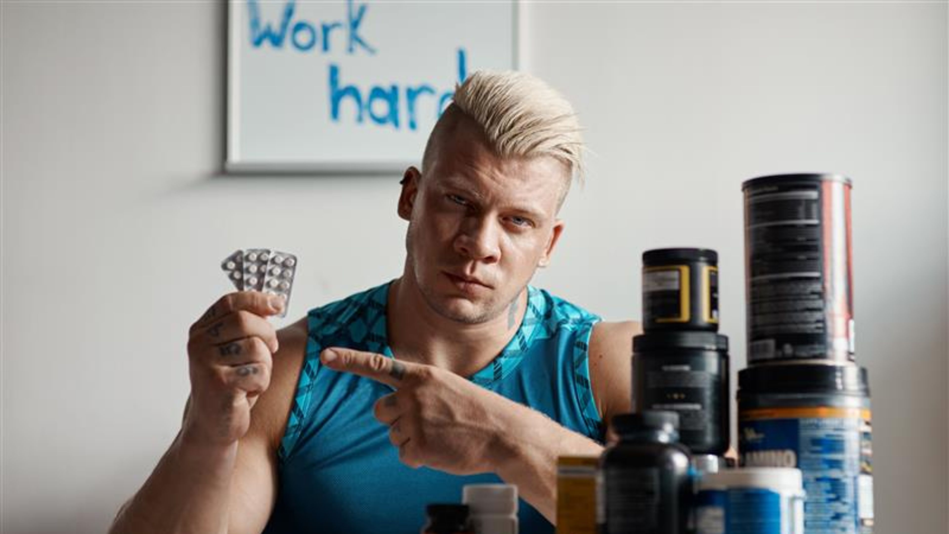 Sports man holding tablet