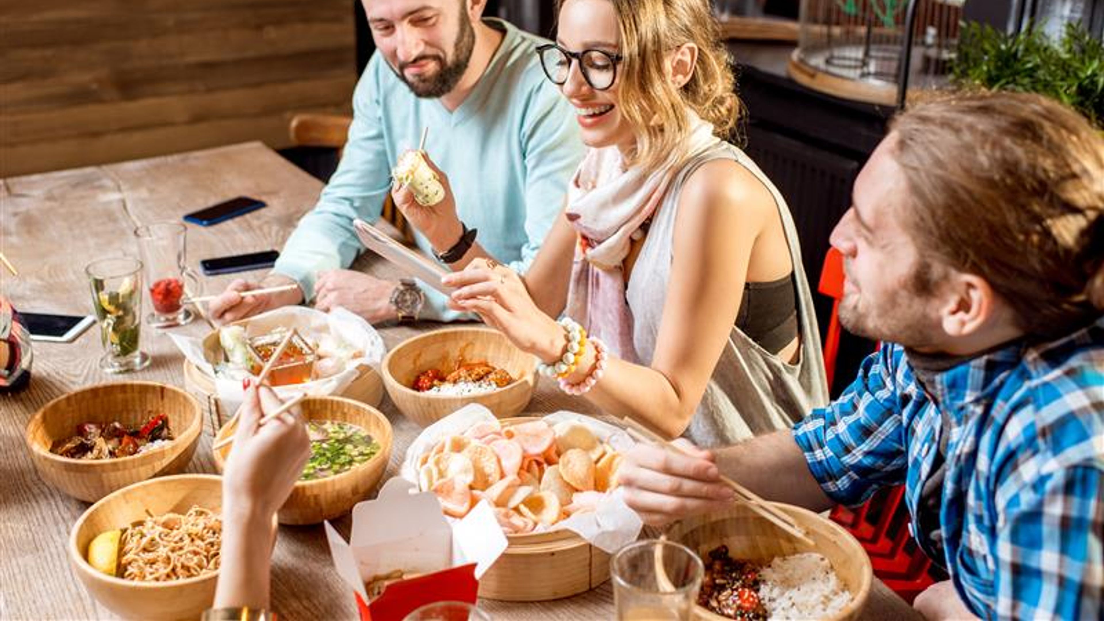 Three friends are having dinner