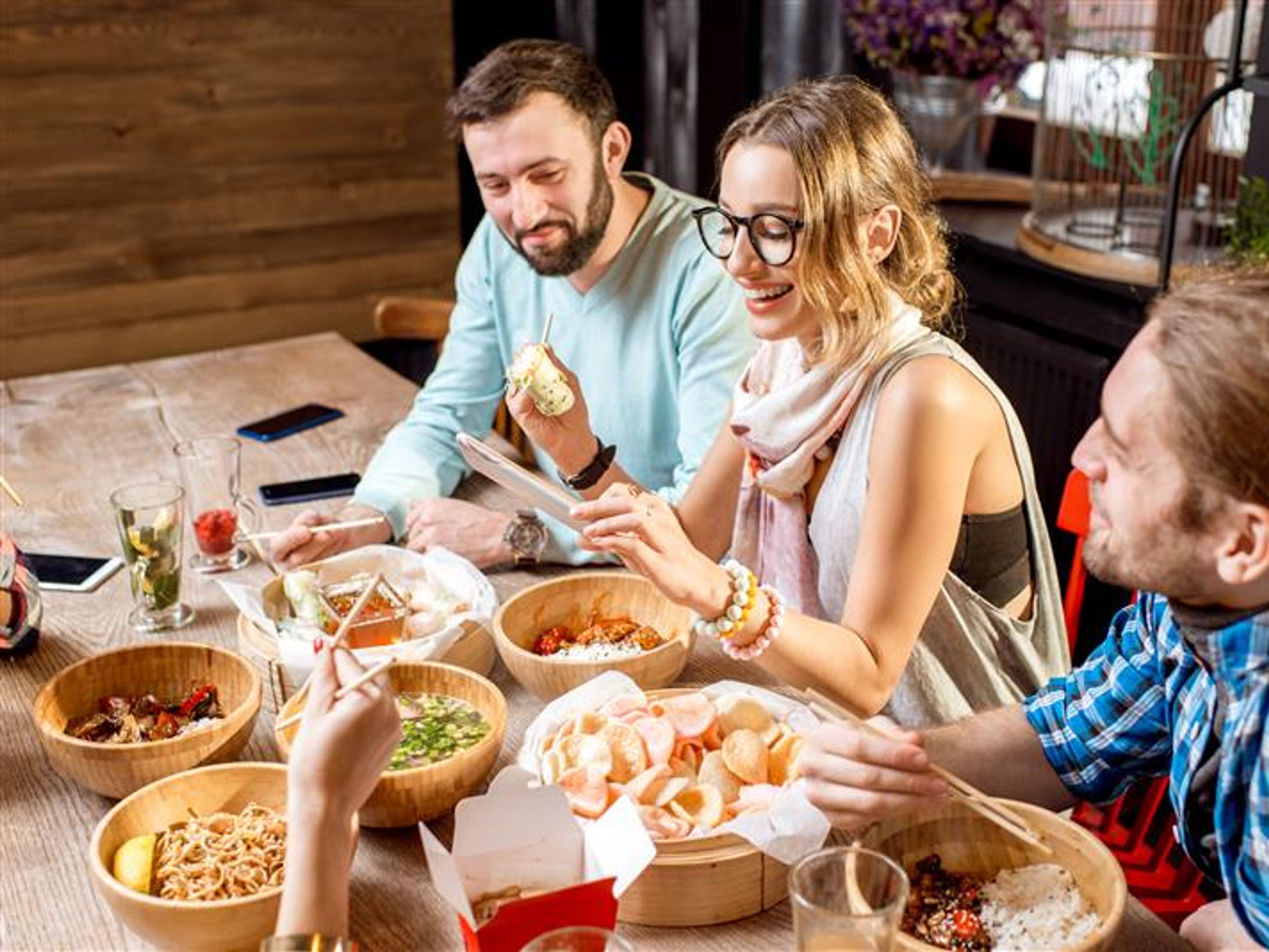 Three friends are having dinner