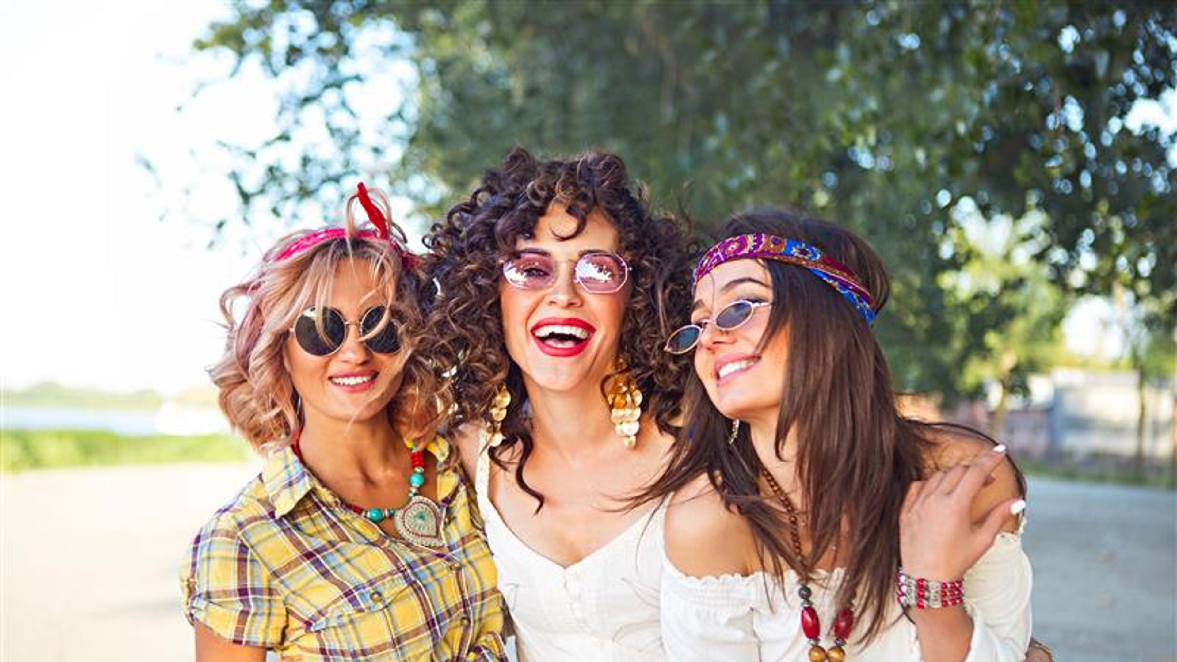 Three women as fashionably dressed
