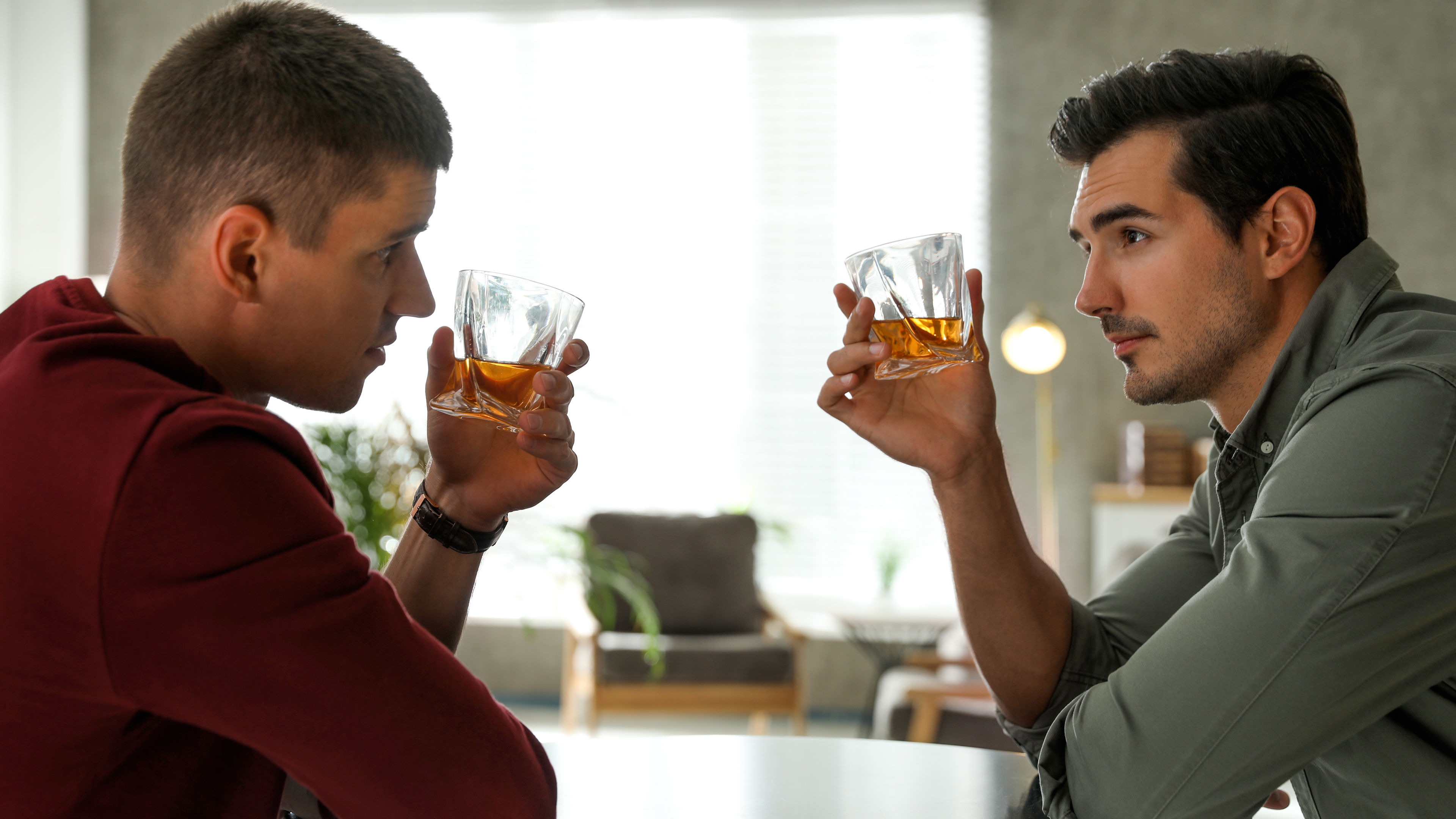 Two men drinking together