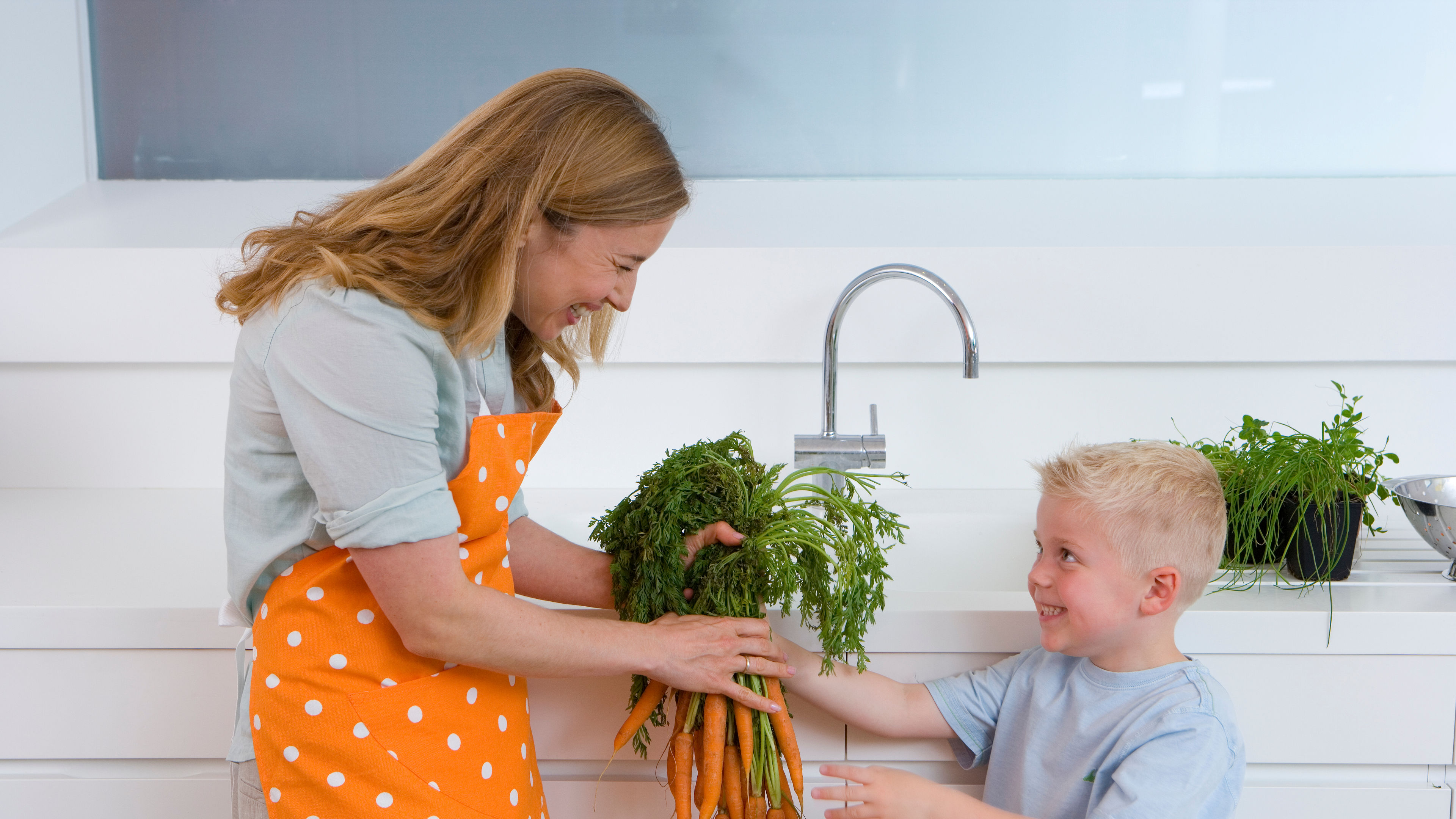 Woman and child with carrots 