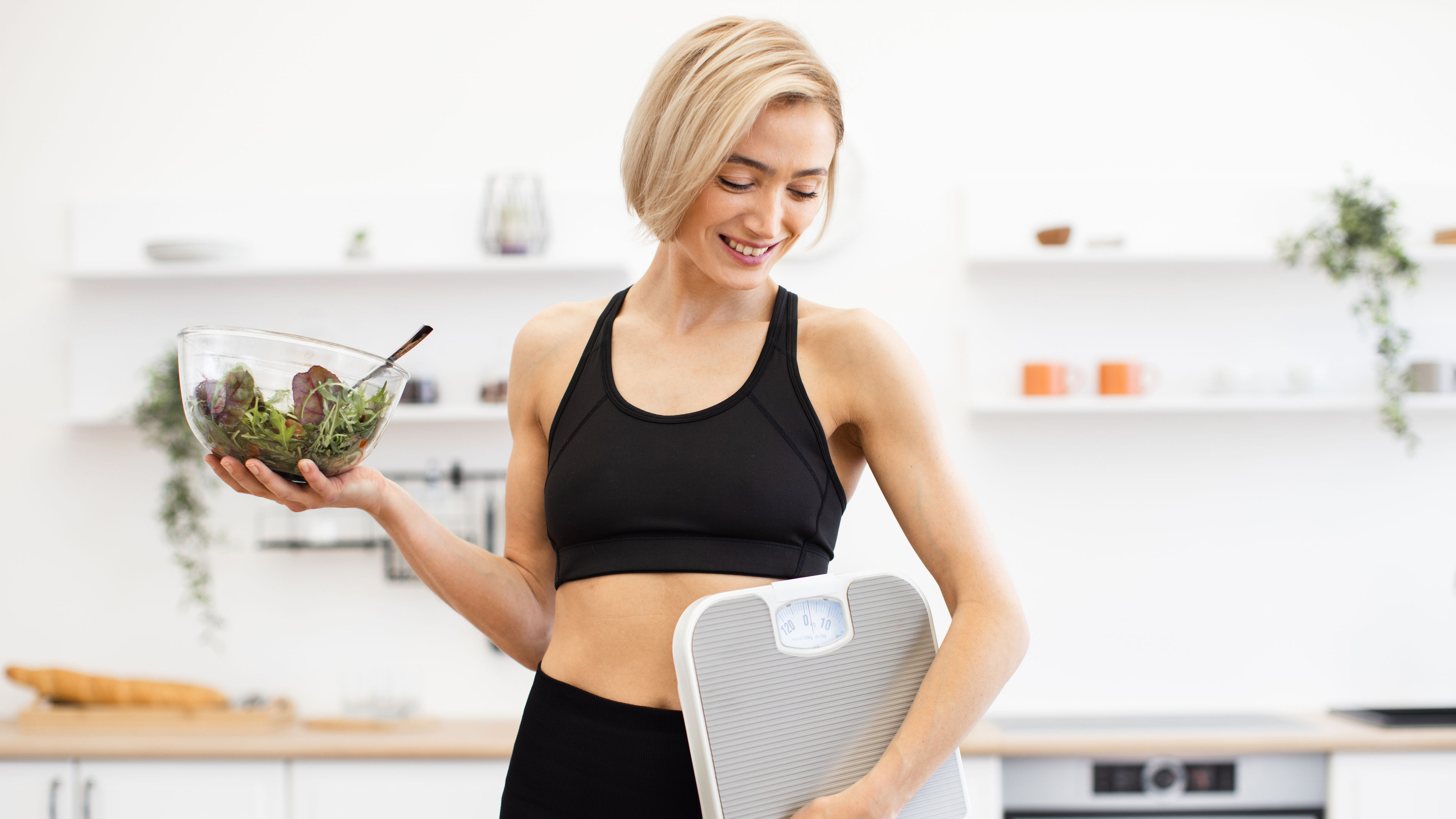 Woman Holding Salad and Scales
