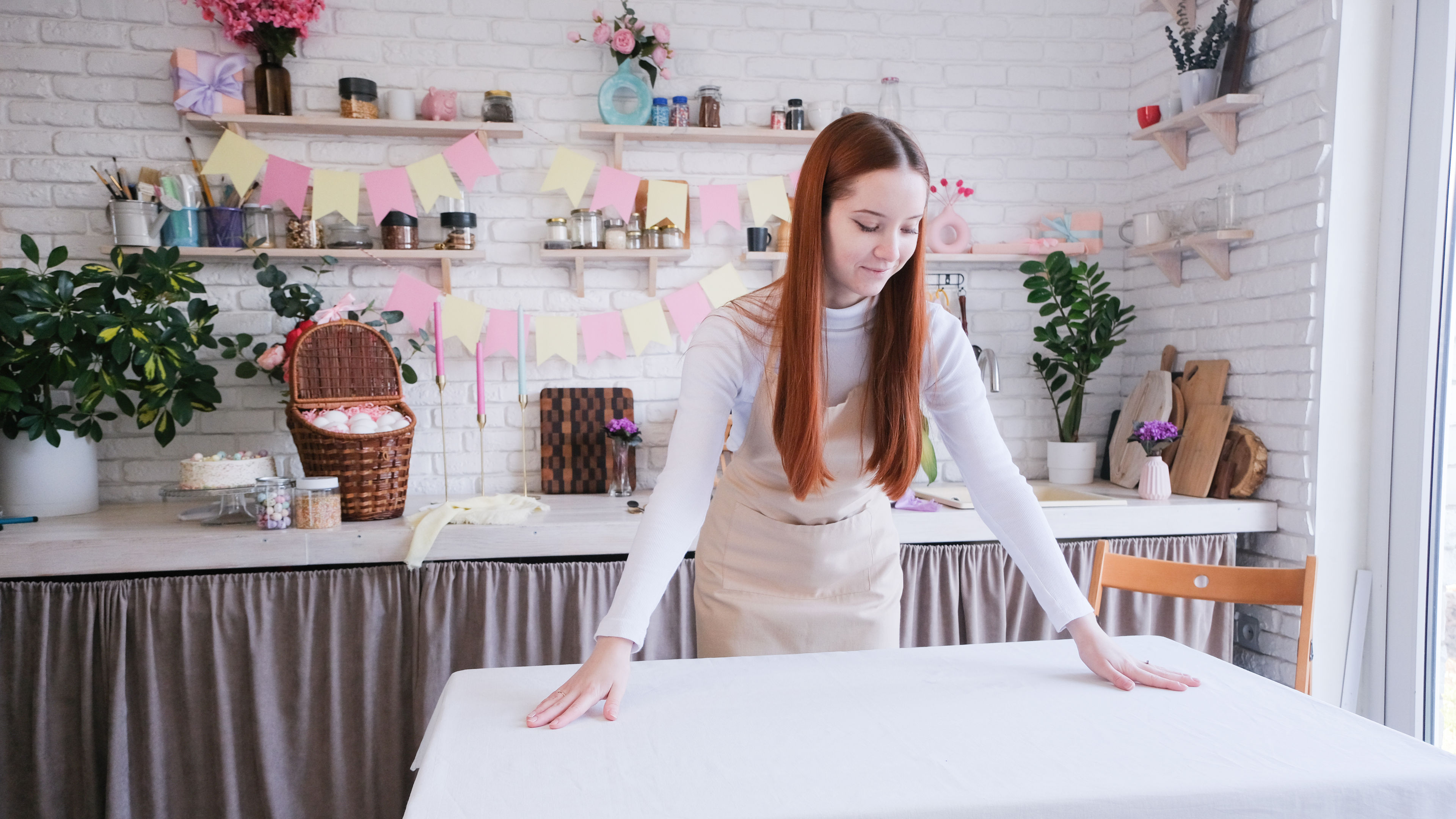 Woman laying table cloth