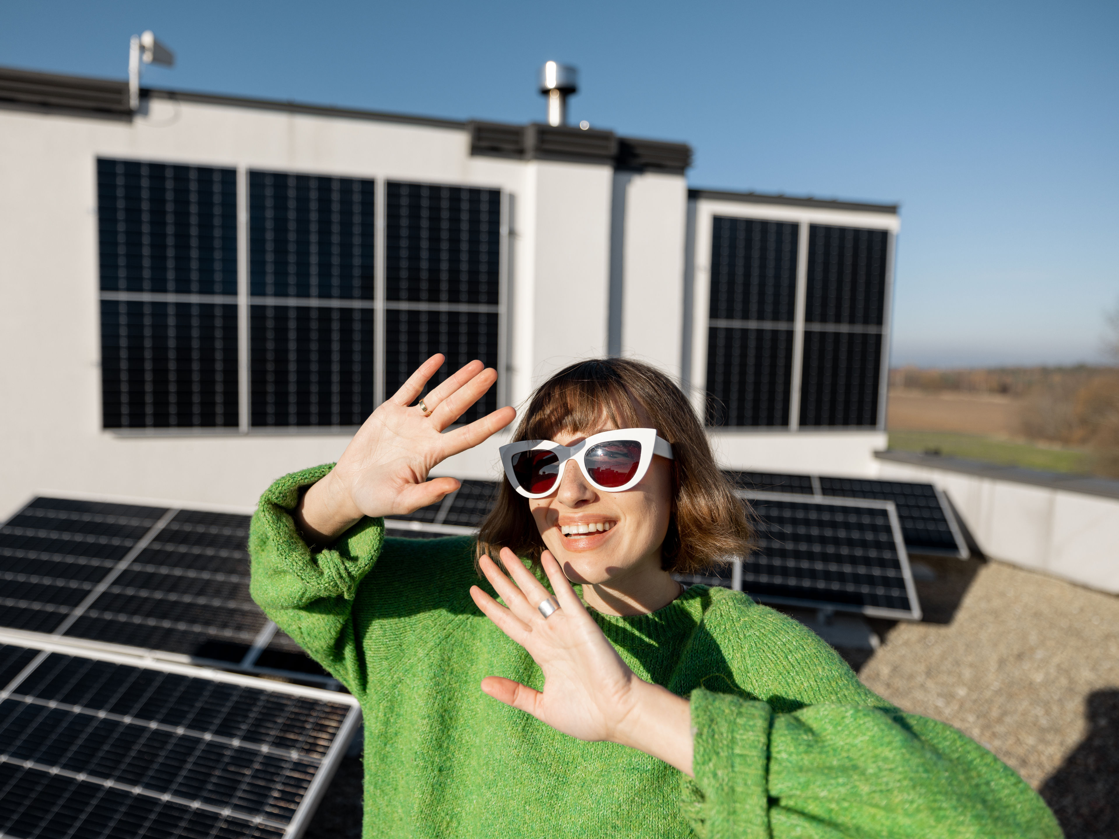 Woman near solar panel 
