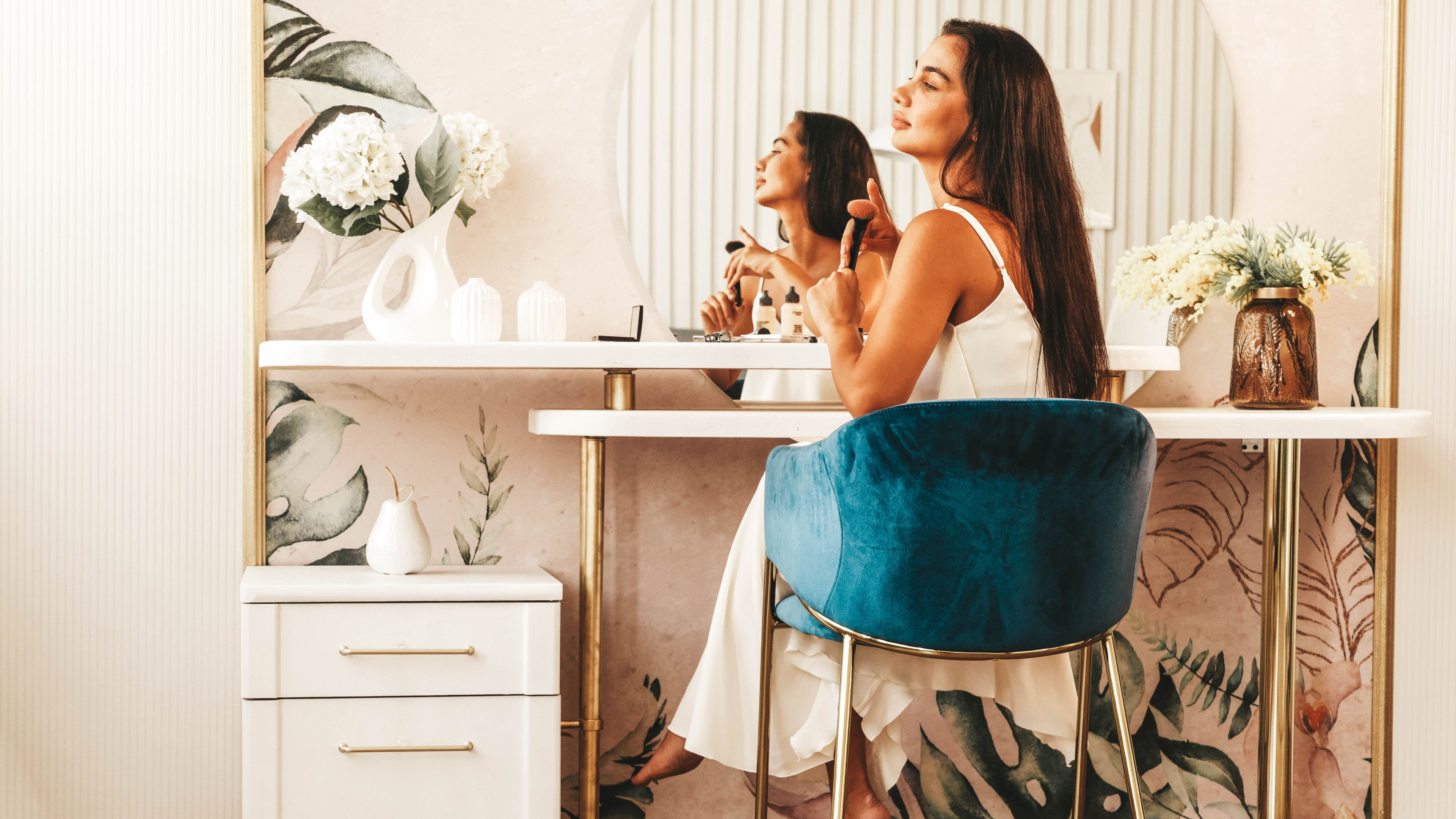 Woman sitting infront of dressing table 